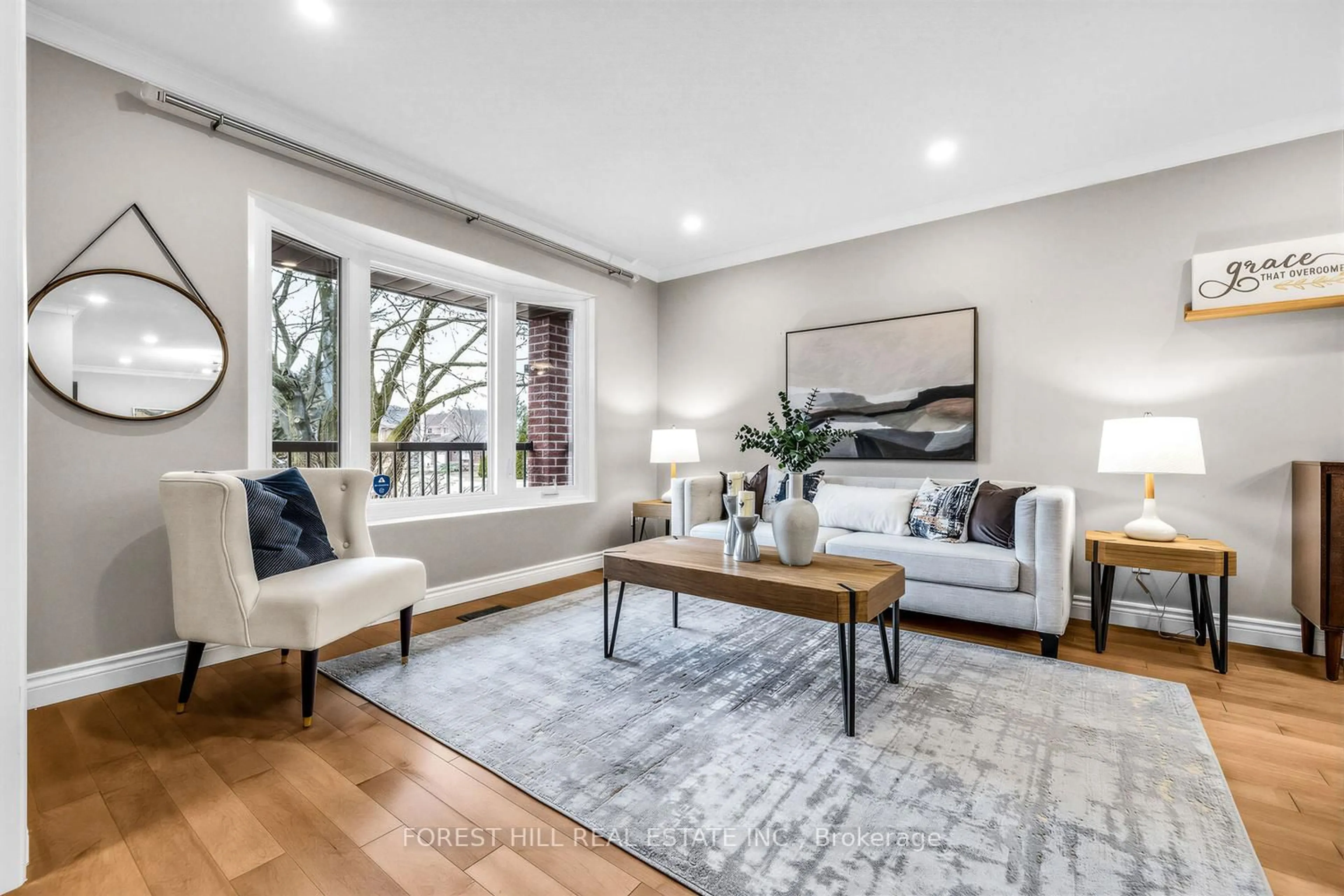 Living room with furniture, wood/laminate floor for 49 Seaton Dr, Aurora Ontario L4G 3W9