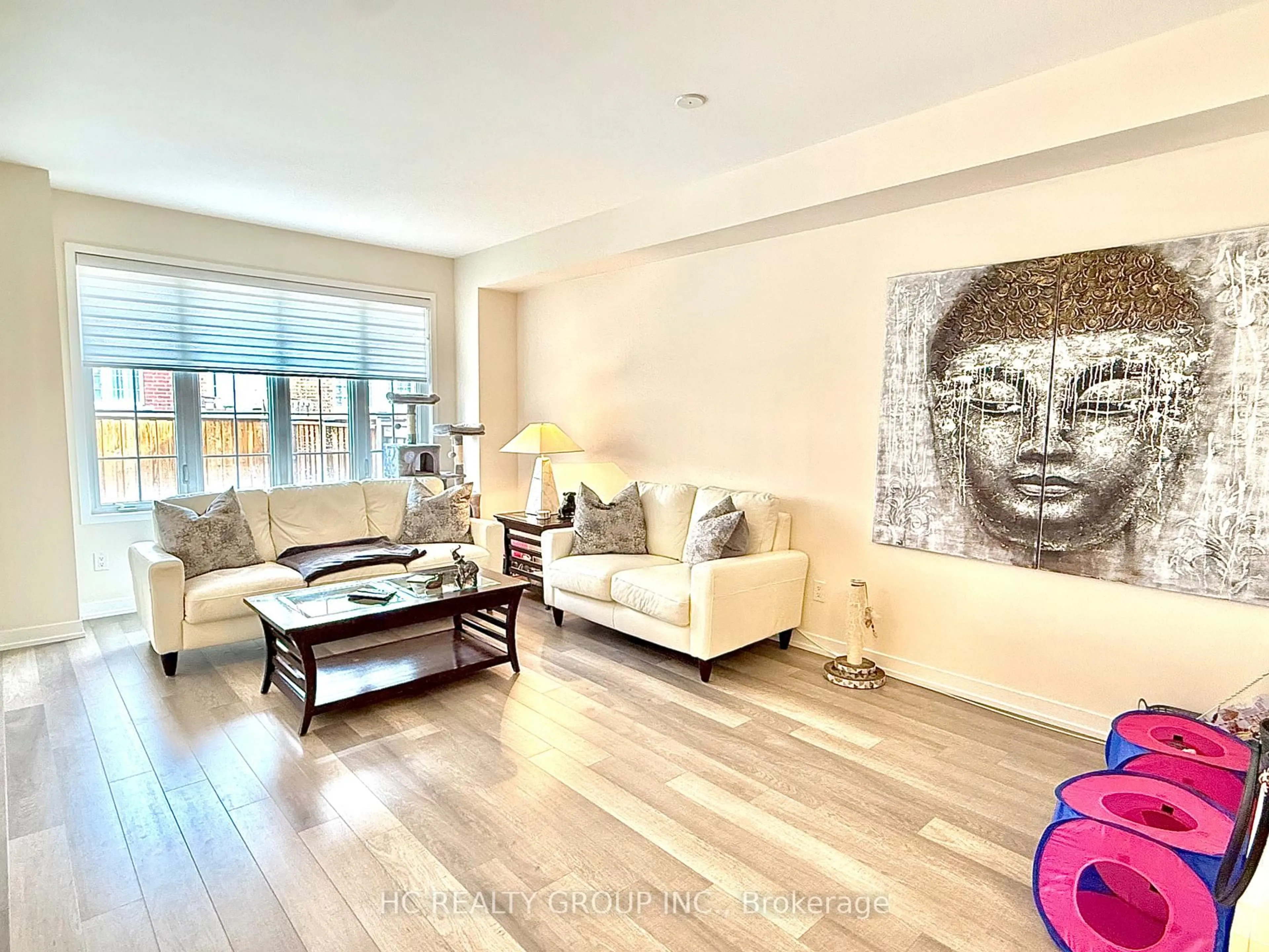 Living room with furniture, wood/laminate floor for 4 Sand Hill Mews, Vaughan Ontario L6A 4Y4