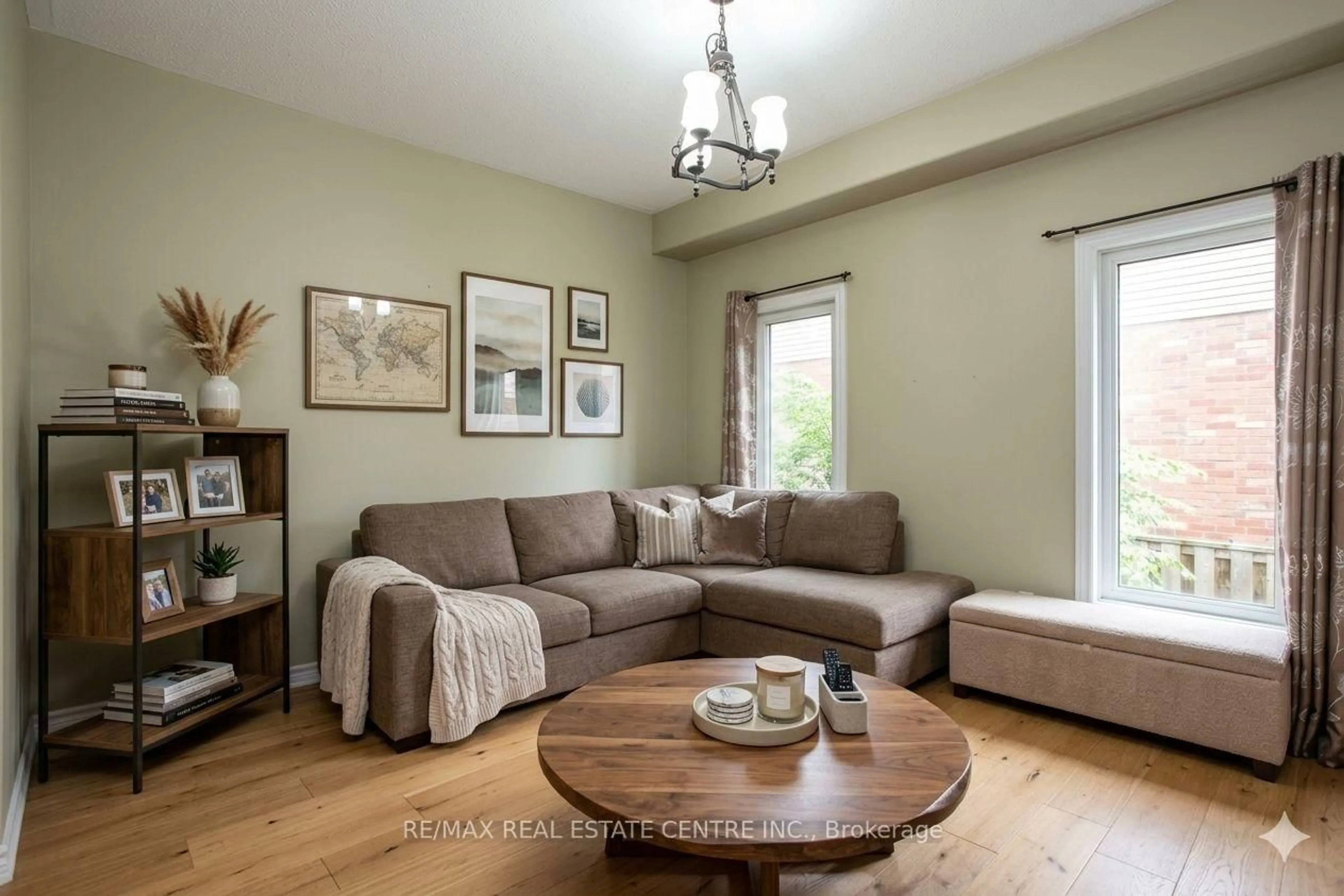 Living room with furniture, wood/laminate floor for 103 Armeda Clow Cres, Essa Ontario L0M 1B2