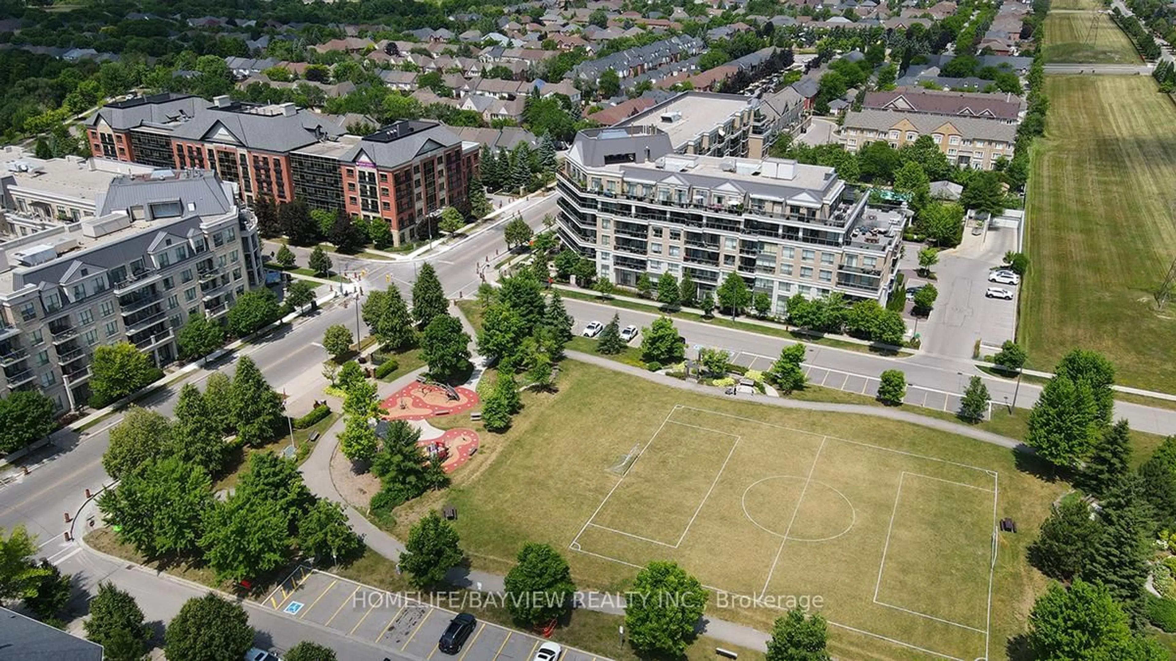A pic from outside/outdoor area/front of a property/back of a property/a pic from drone, city buildings view from balcony for 111 Civic Square Gate #216, Aurora Ontario L4G 0S6