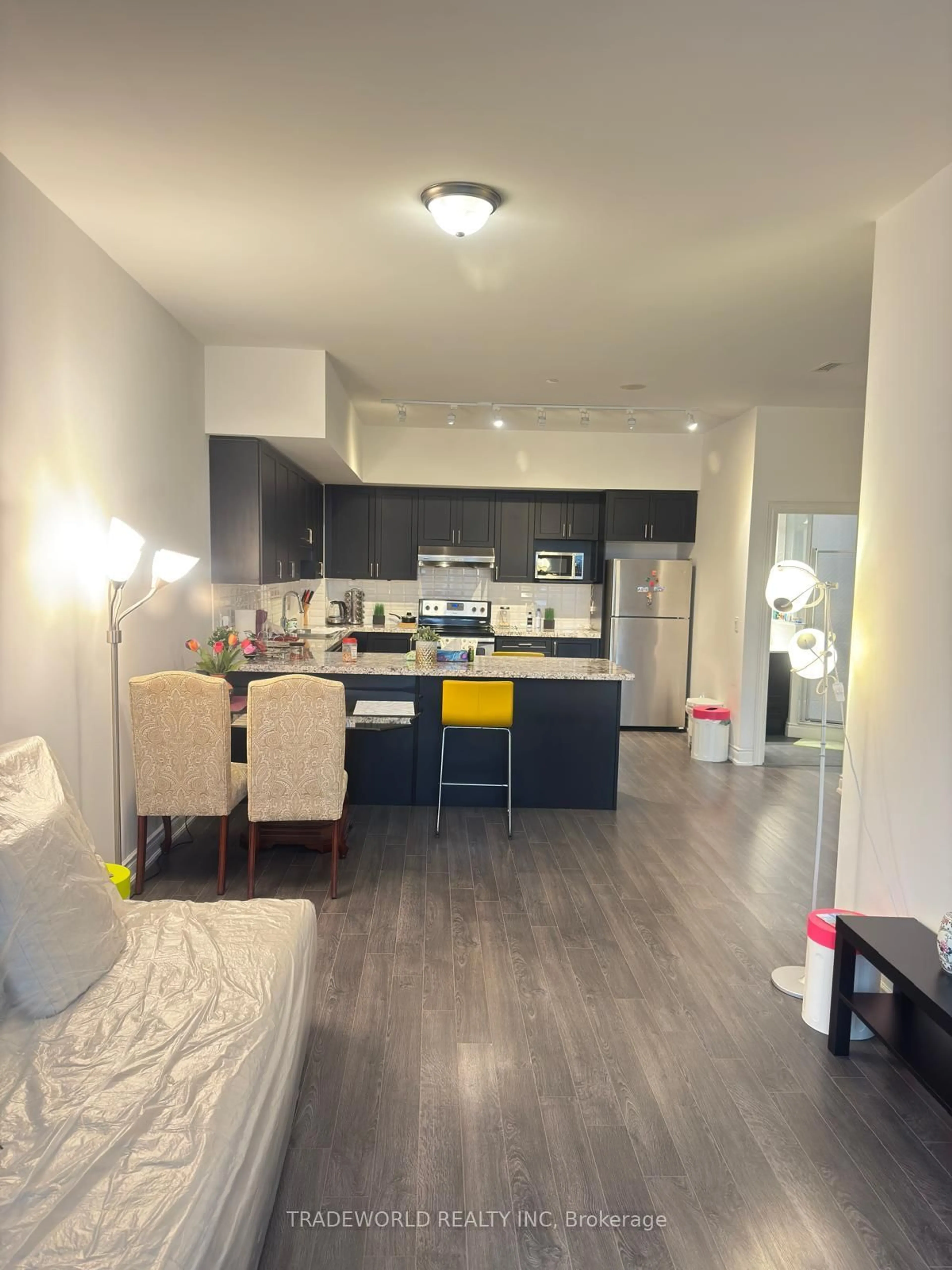 Open concept kitchen, wood/laminate floor for 99 South Town Centre Blvd #B-102, Markham Ontario L6G 0E9