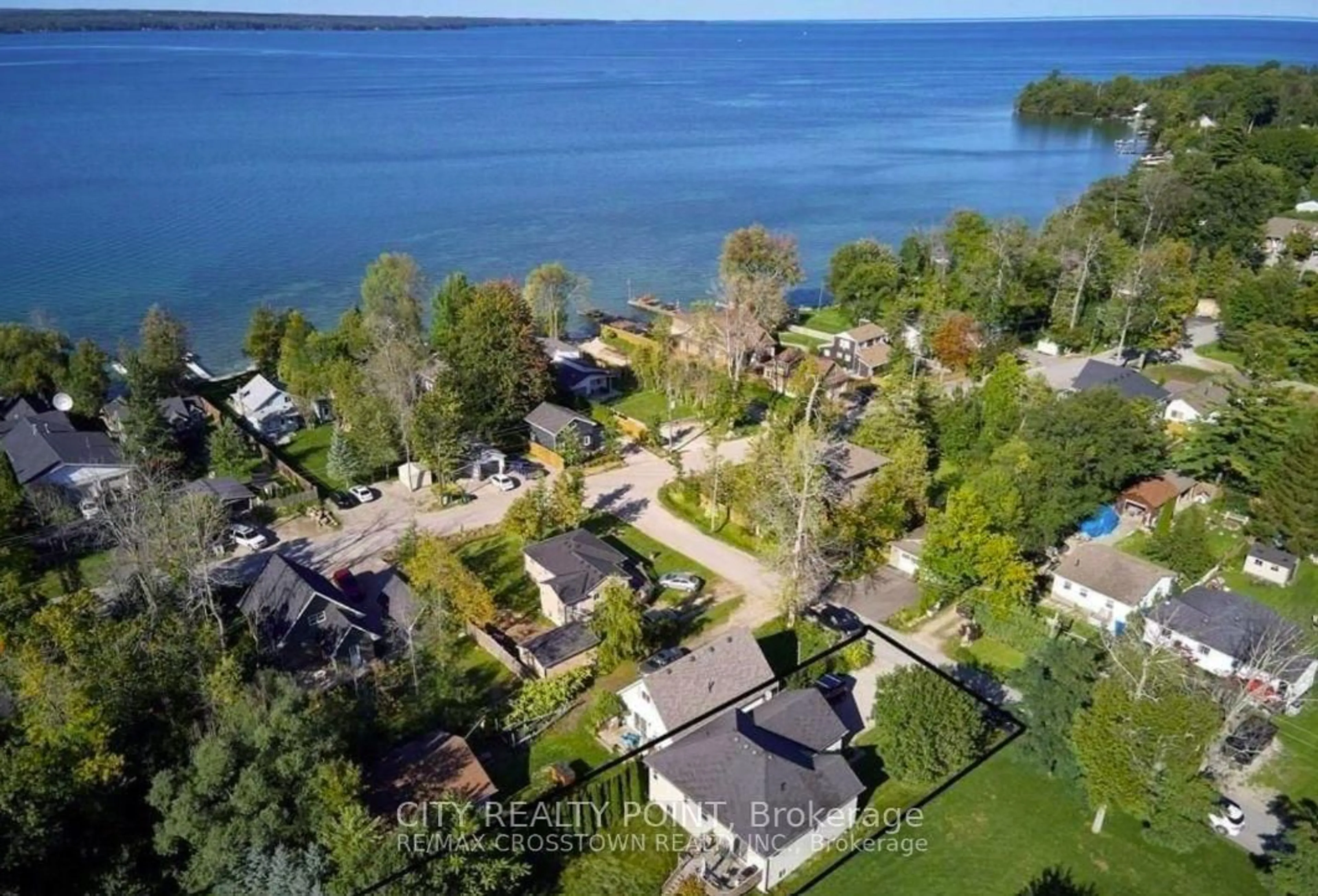 A pic from outside/outdoor area/front of a property/back of a property/a pic from drone, water/lake/river/ocean view for 3964 Alcina Ave, Innisfil Ontario L9S 2M1