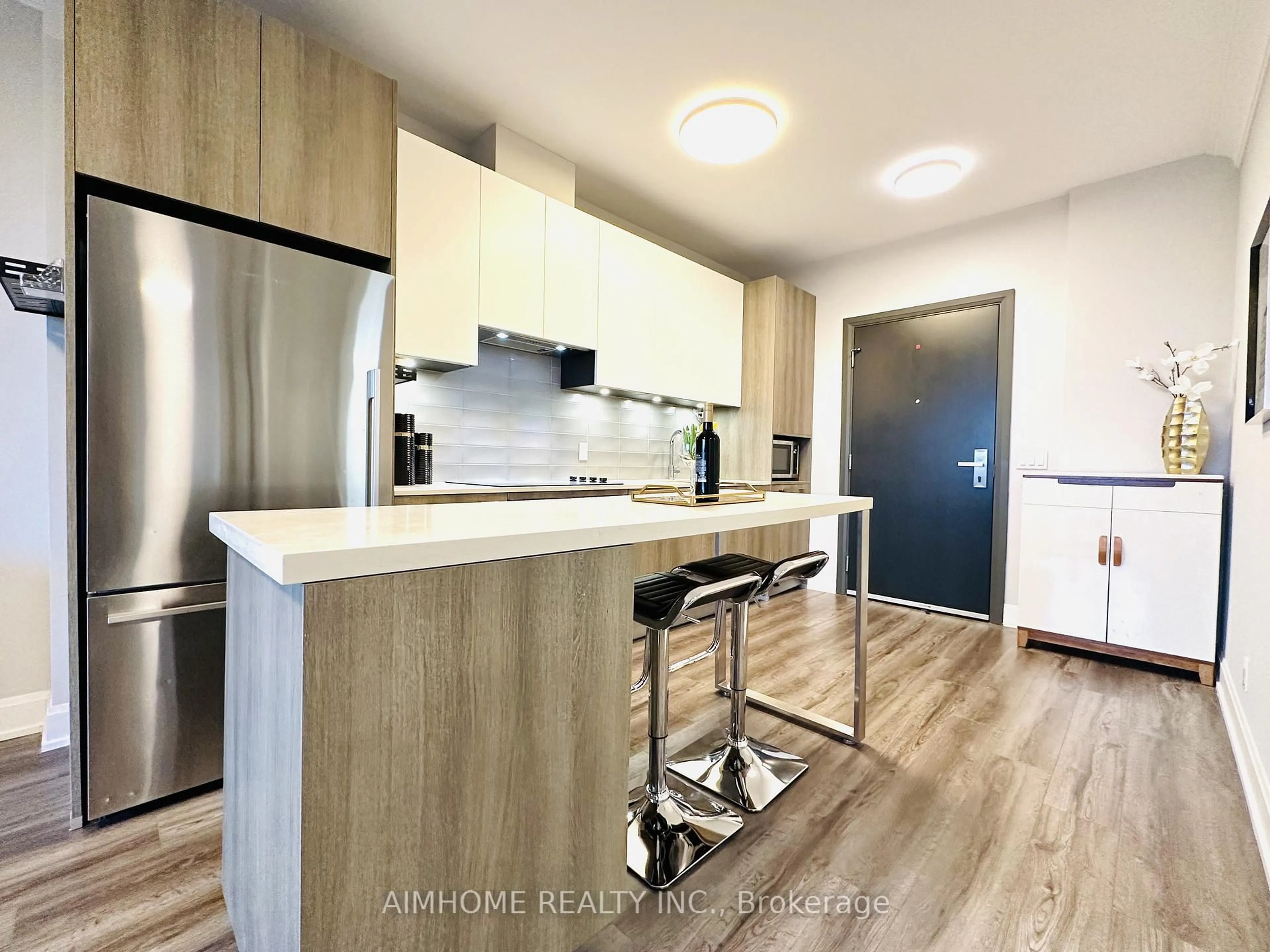 Open concept kitchen, wood/laminate floor for 38 Water Walk Dr #910, Markham Ontario L3R 6M8