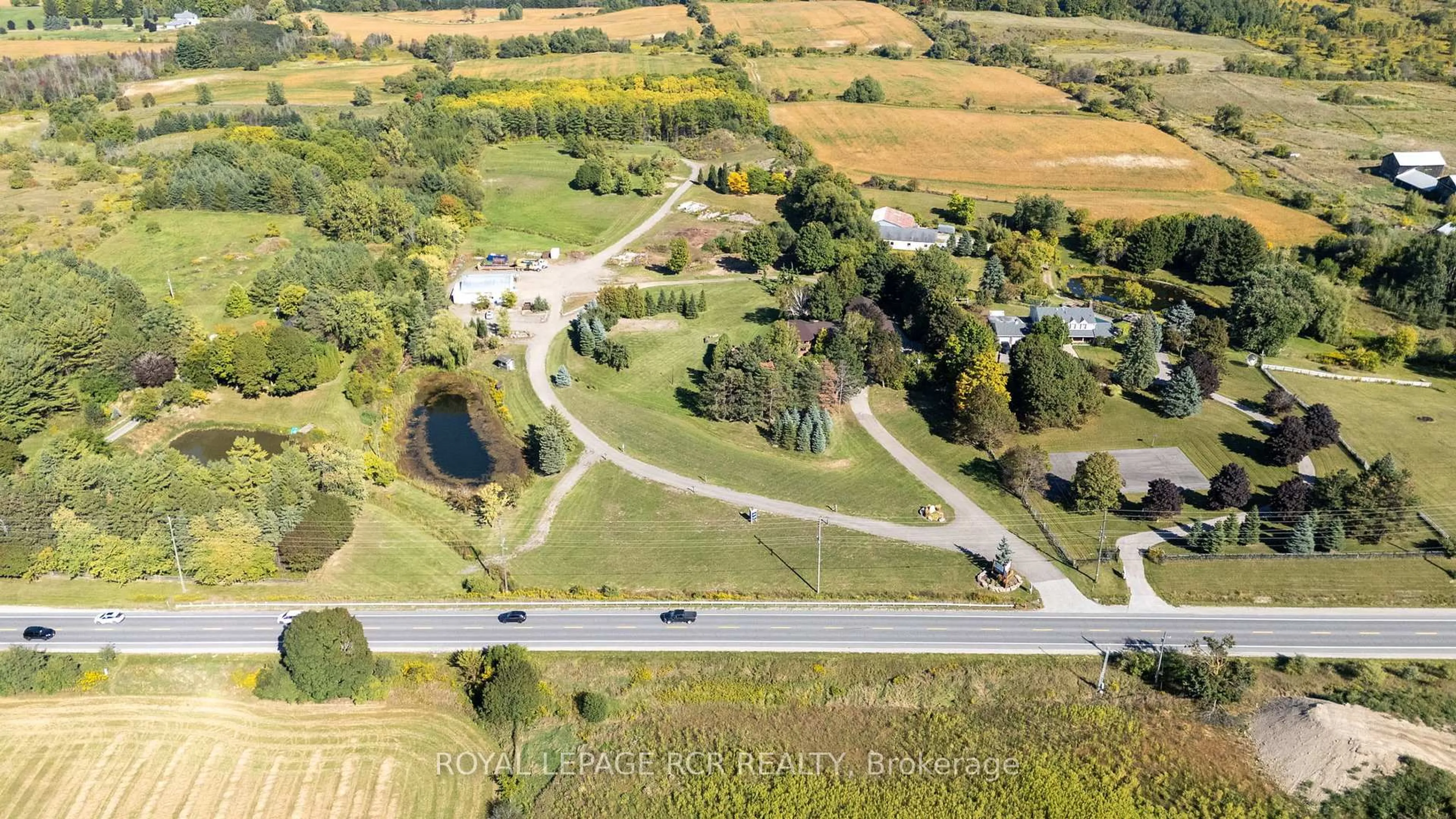 A pic from outside/outdoor area/front of a property/back of a property/a pic from drone, street for 15735 Highway 27, King Ontario L0G 1T0