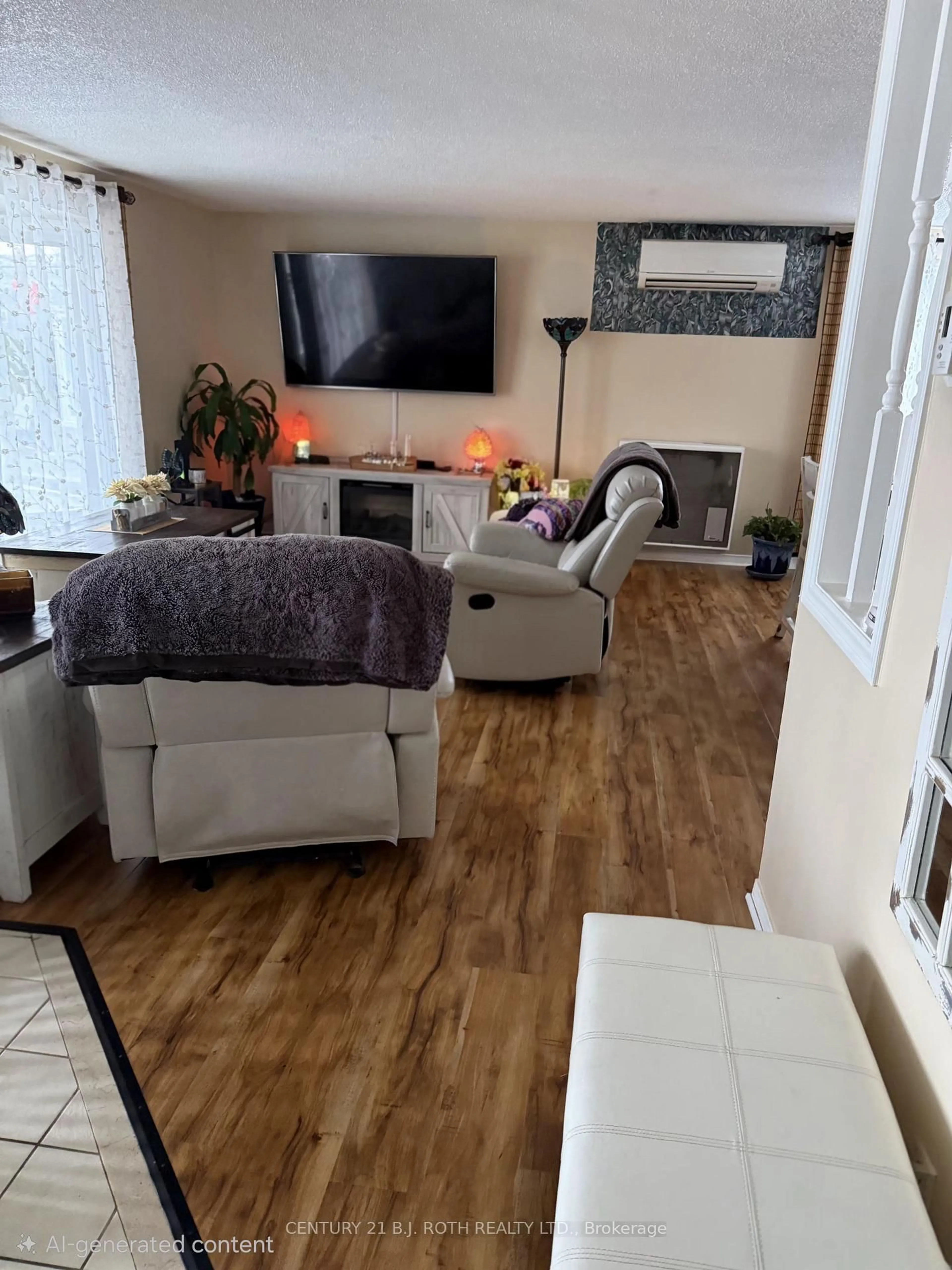 Living room with furniture, wood/laminate floor for 25 Comforts Cove Cres, Innisfil Ontario L9S 1S3