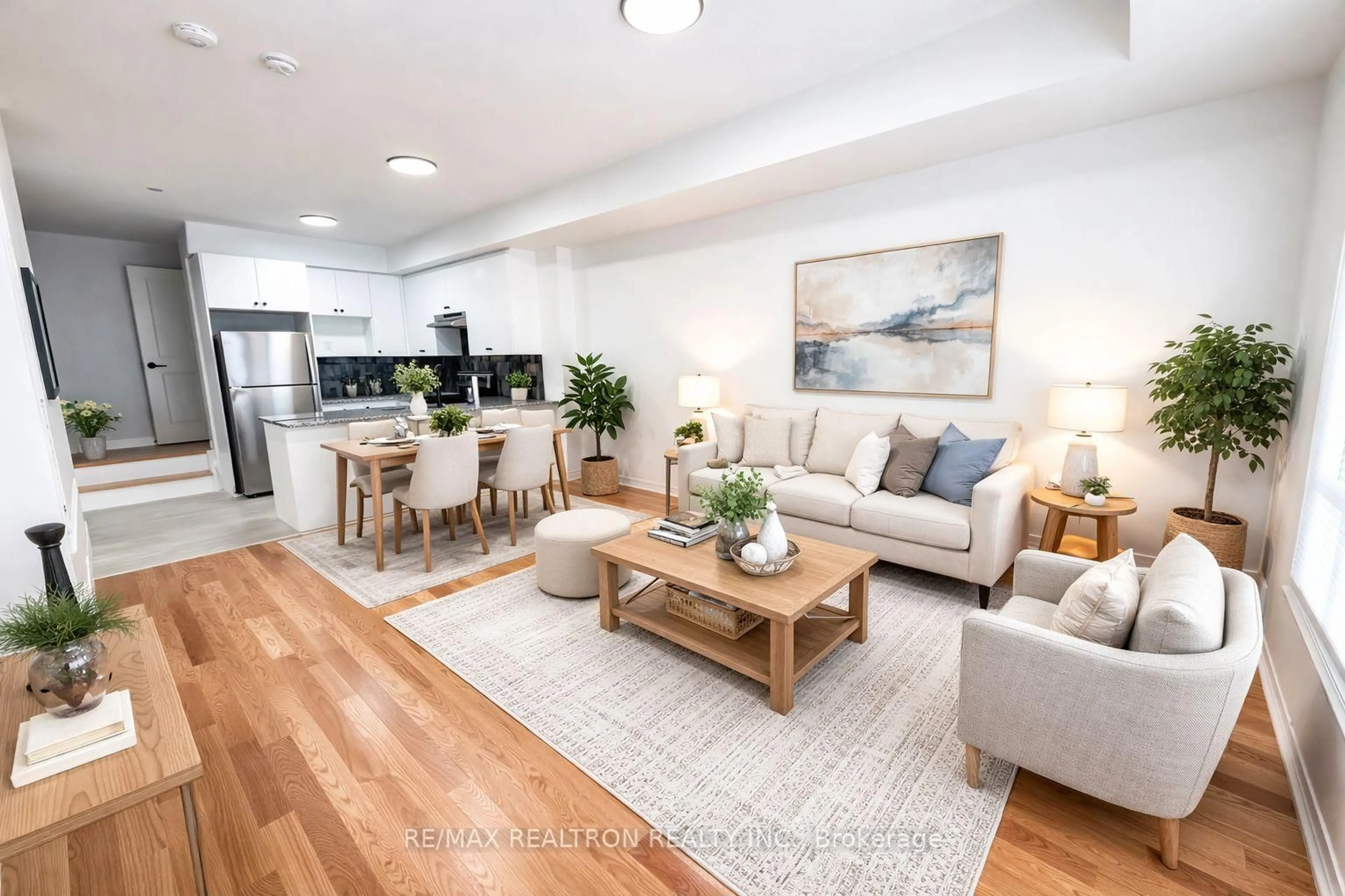 Living room with furniture, wood/laminate floor for 60 Baynes Way #12, Bradford West Gwillimbury Ontario L6G 0E3