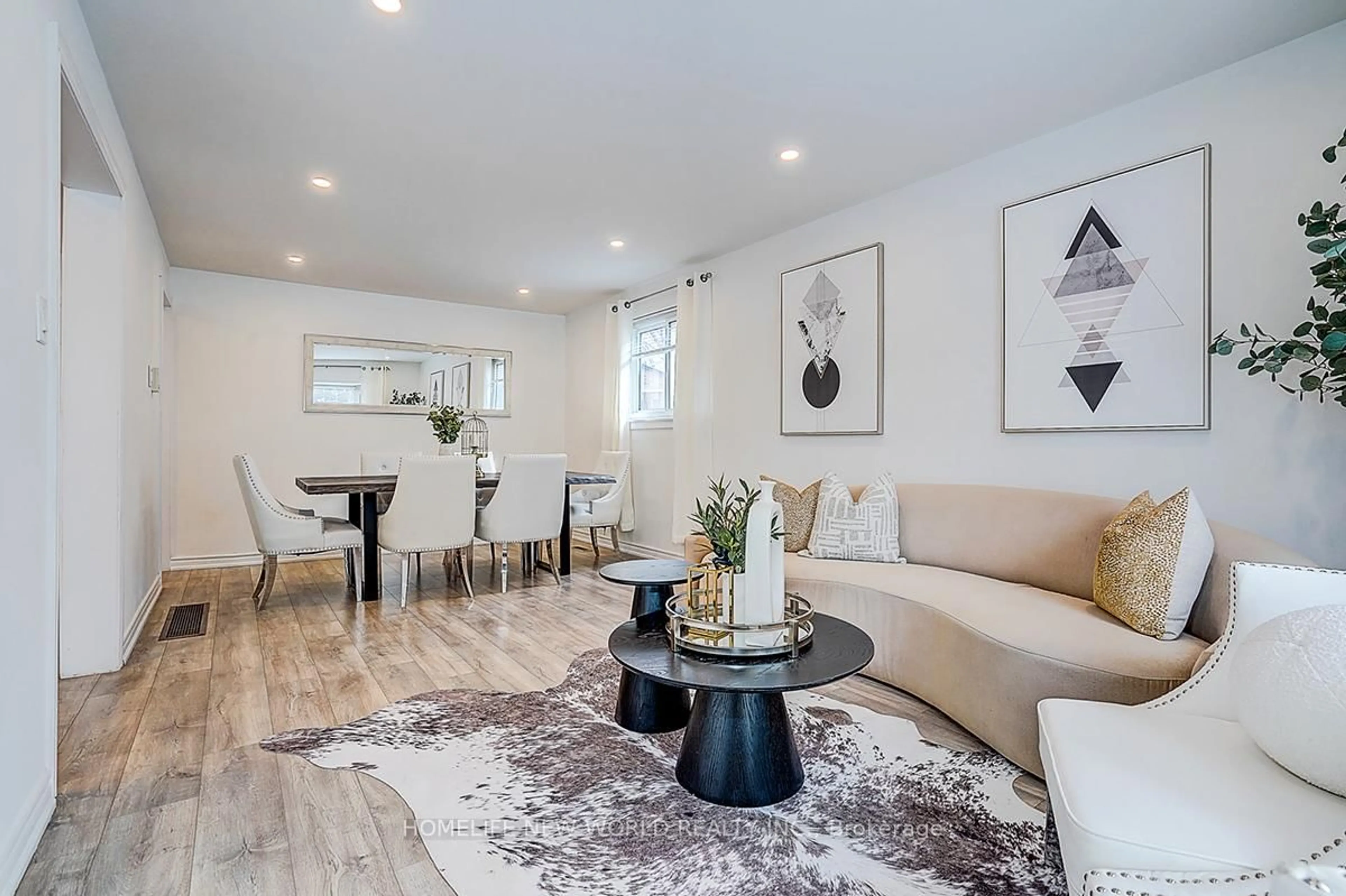 Living room with furniture, wood/laminate floor for 715 Irwin Cres, Newmarket Ontario L3Y 5A4