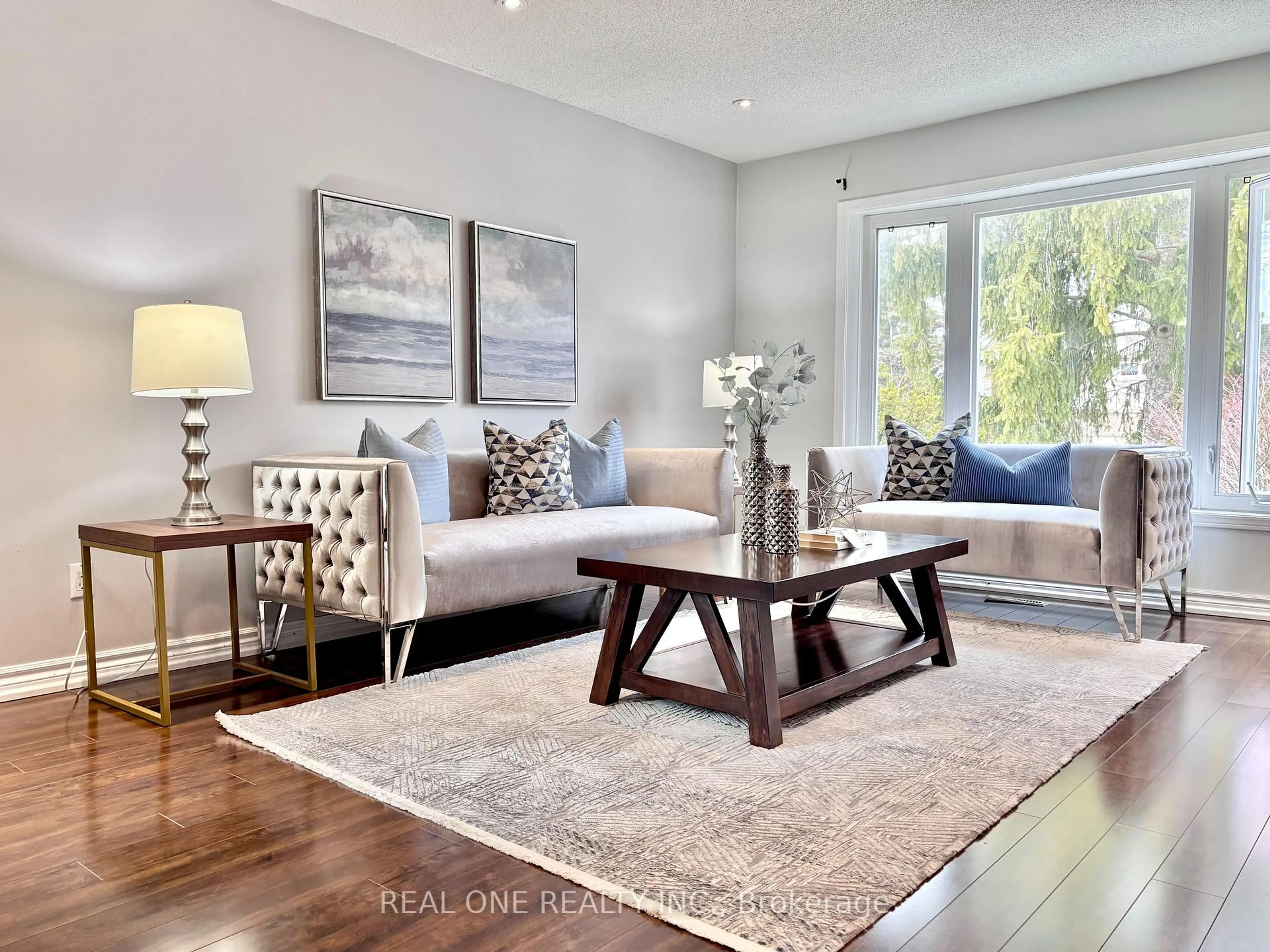 Living room with furniture, wood/laminate floor for 9 Breckonwood Cres, Markham Ontario L3T 5G8