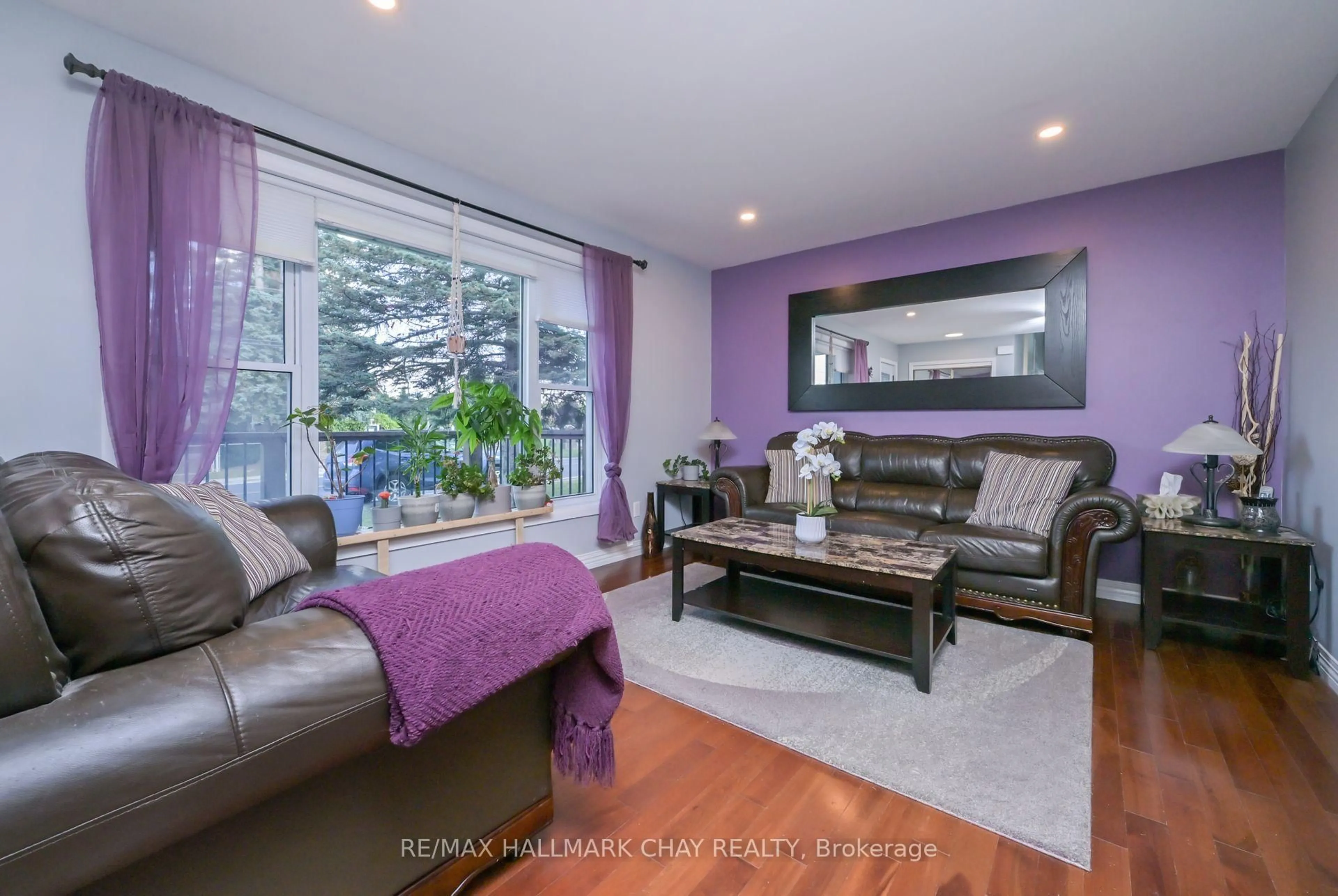 Living room with furniture, wood/laminate floor for 6098 County Rd 13 Rd, Adjala-Tosorontio Ontario L0M 1J0