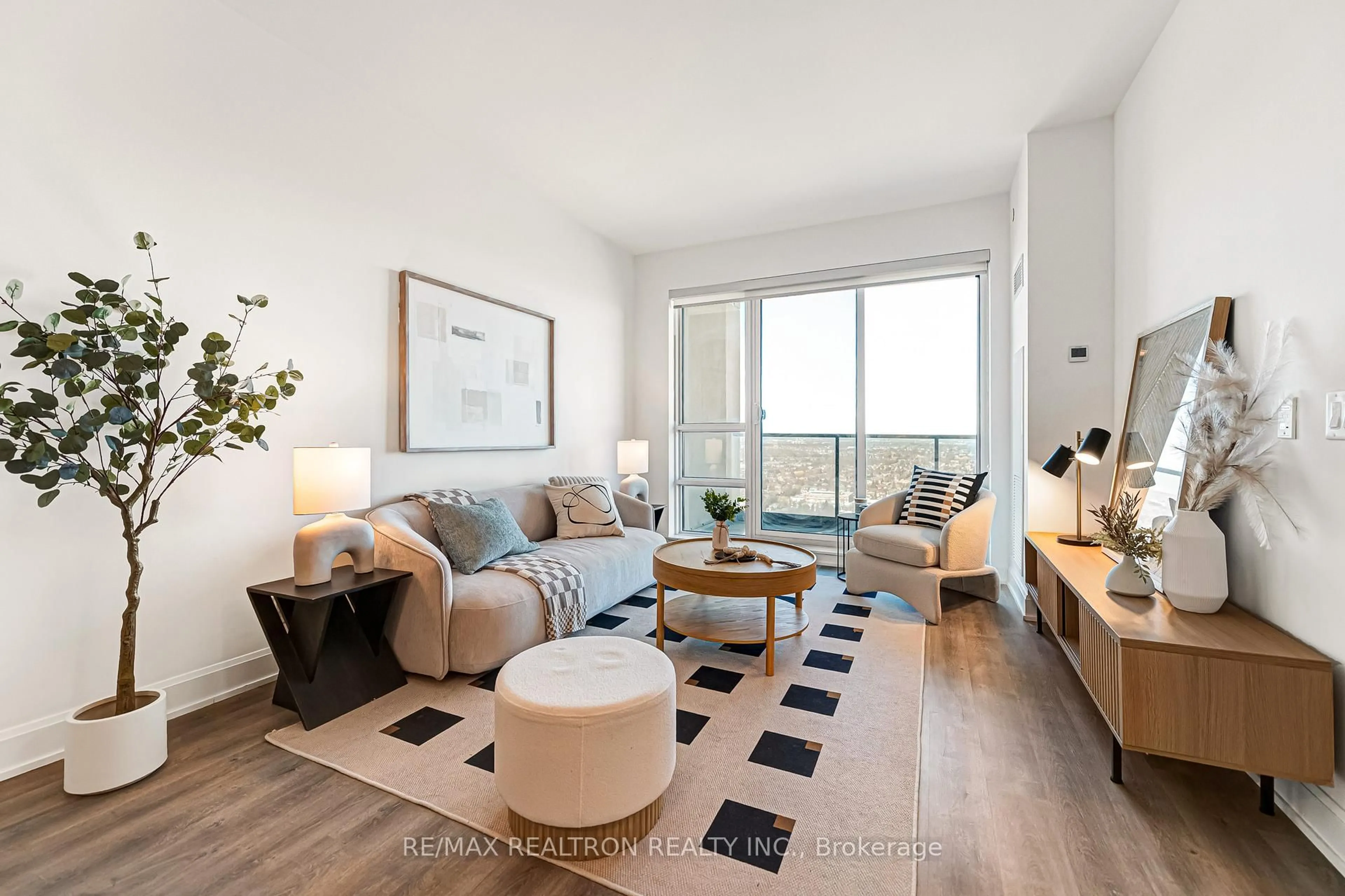 Living room with furniture, wood/laminate floor for 12 Gandhi Lane #3302, Markham Ontario L3T 0G8