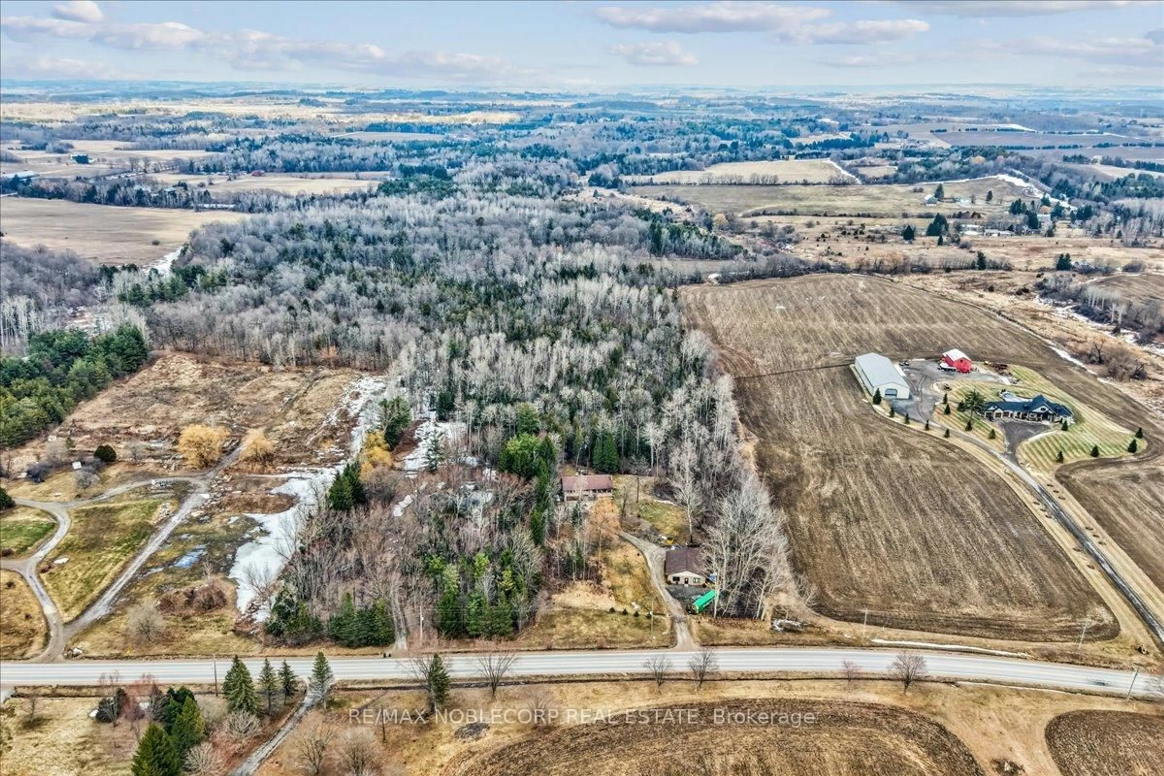A pic from outside/outdoor area/front of a property/back of a property/a pic from drone, forest/trees view for 1945 10th Sdrd, New Tecumseth Ontario L0G 1W0