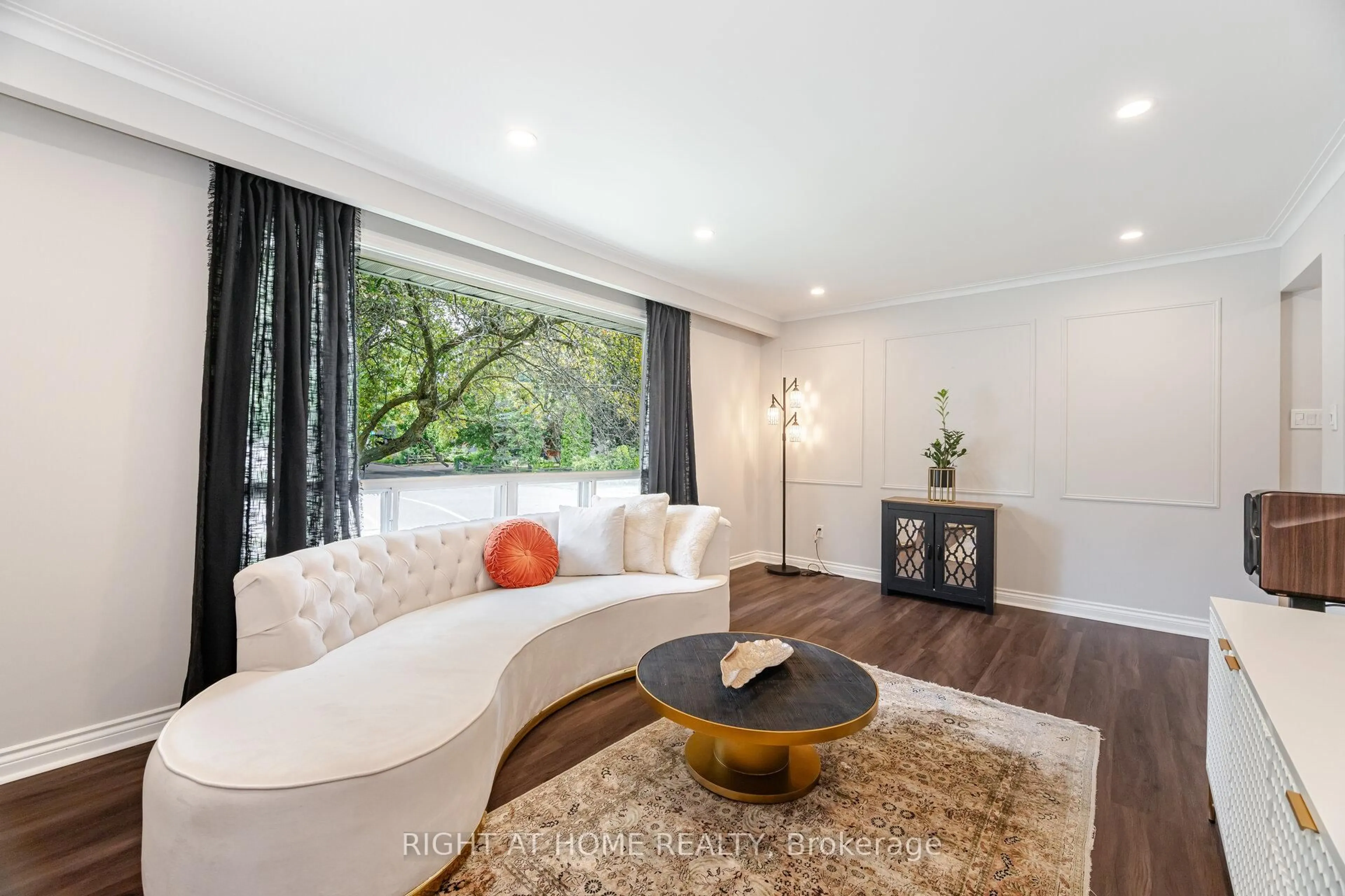 Living room with furniture, wood/laminate floor for 15 Kemano Rd, Aurora Ontario L4G 2Y2