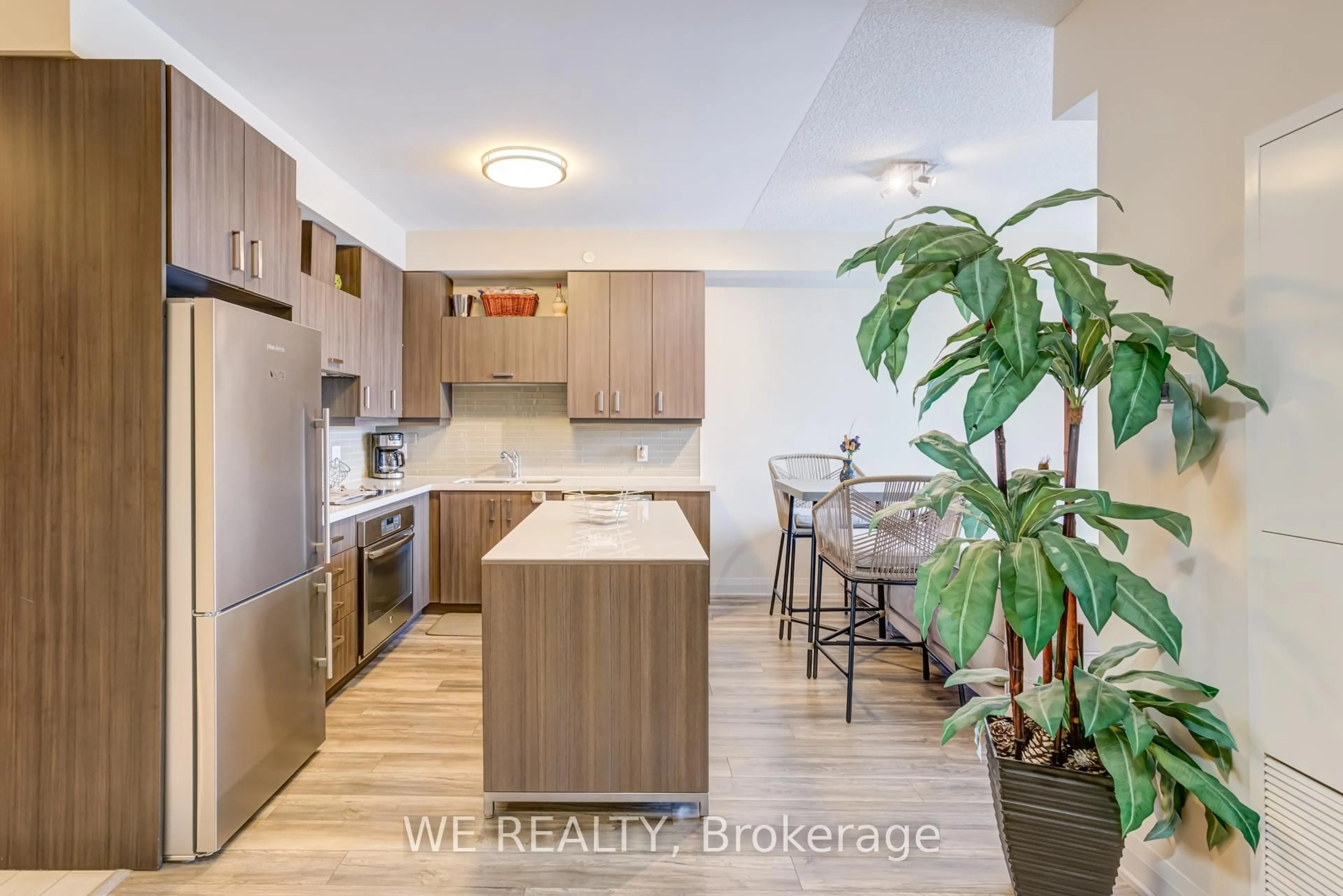 Open concept kitchen, wood/laminate floor for 28 Uptown Dr #316, Markham Ontario L3R 5M8