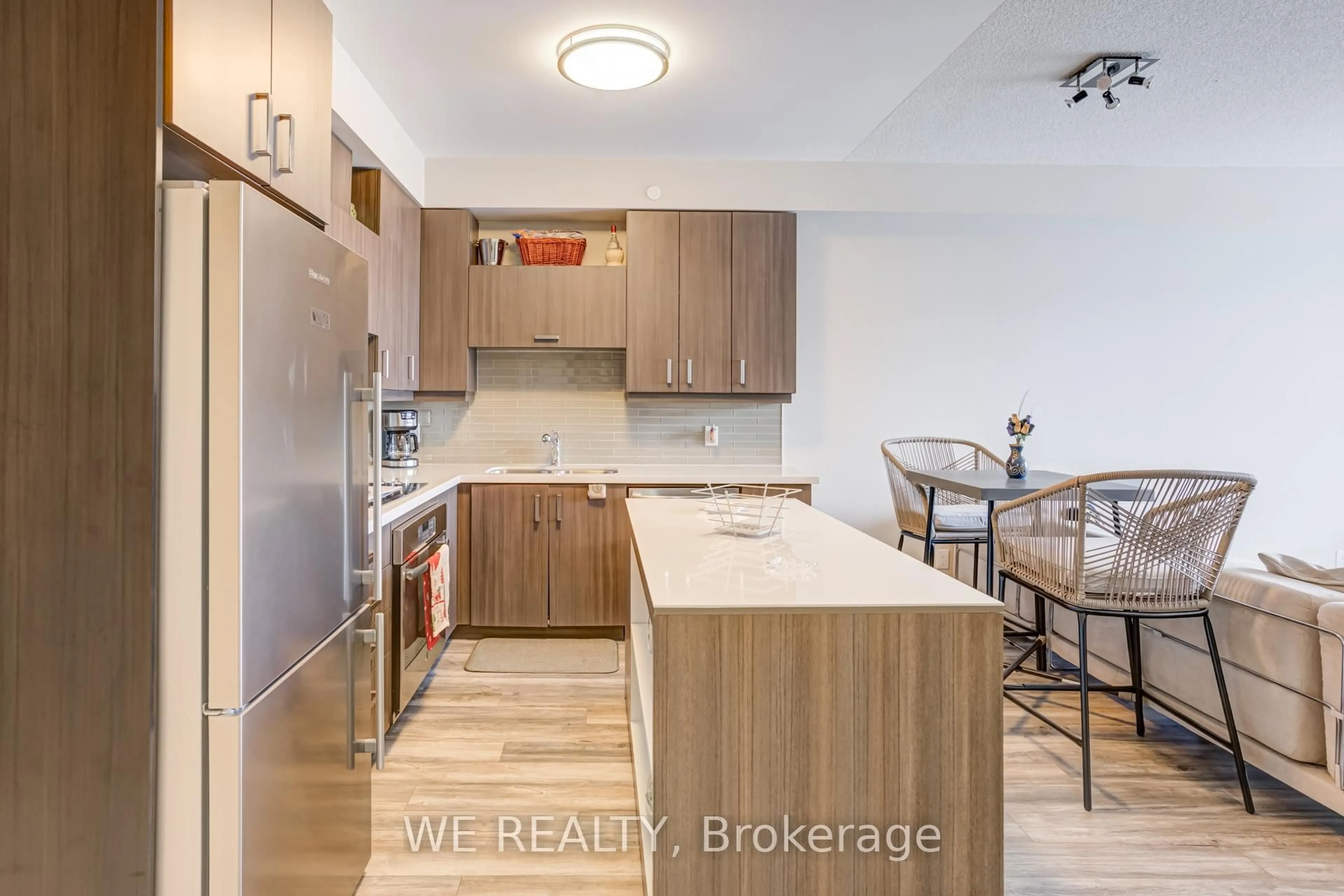 Open concept kitchen, wood/laminate floor for 28 Uptown Dr #316, Markham Ontario L3R 5M8