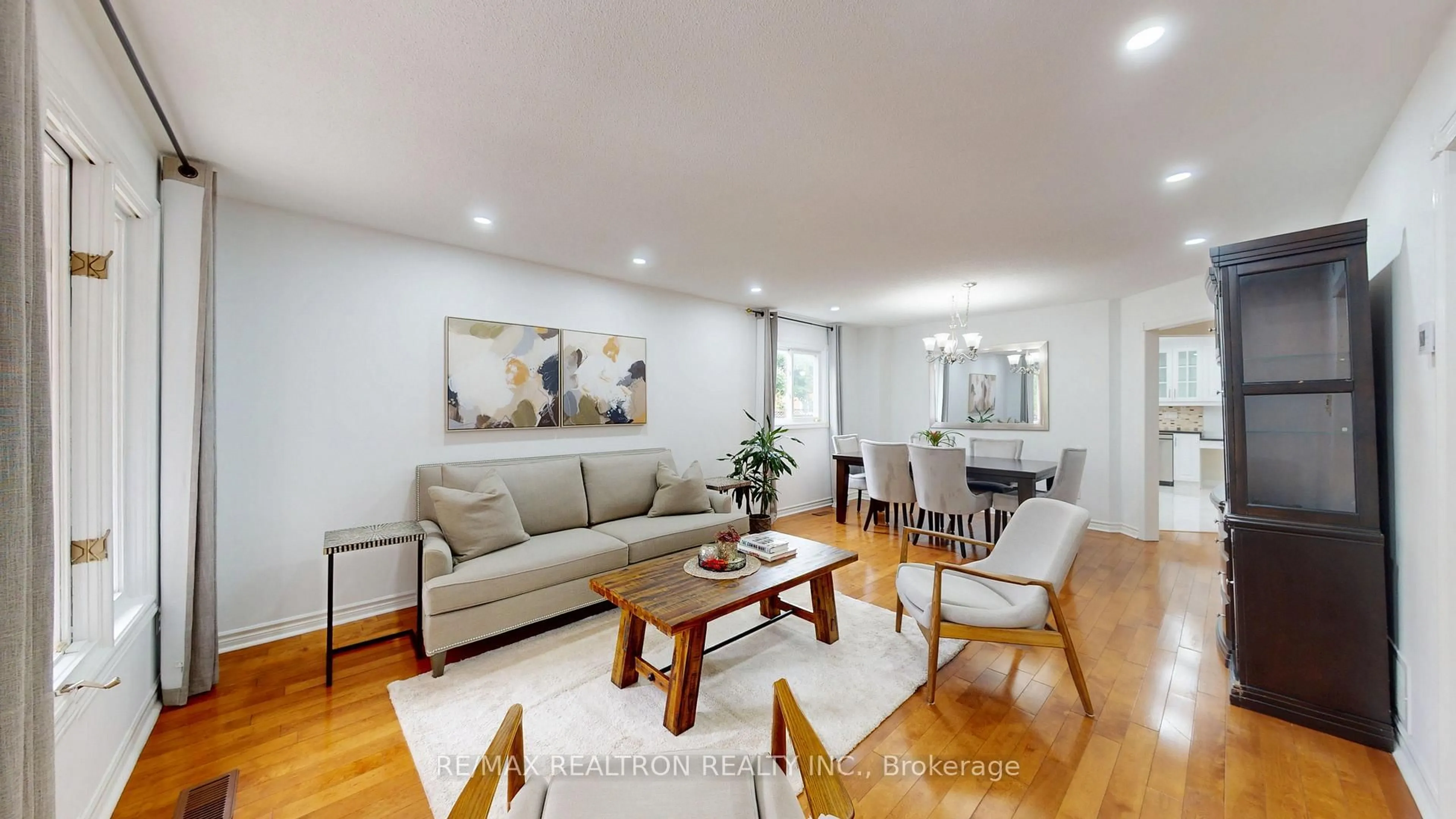 Living room with furniture, wood/laminate floor for 8 Muster Cres, Markham Ontario L3R 9G5