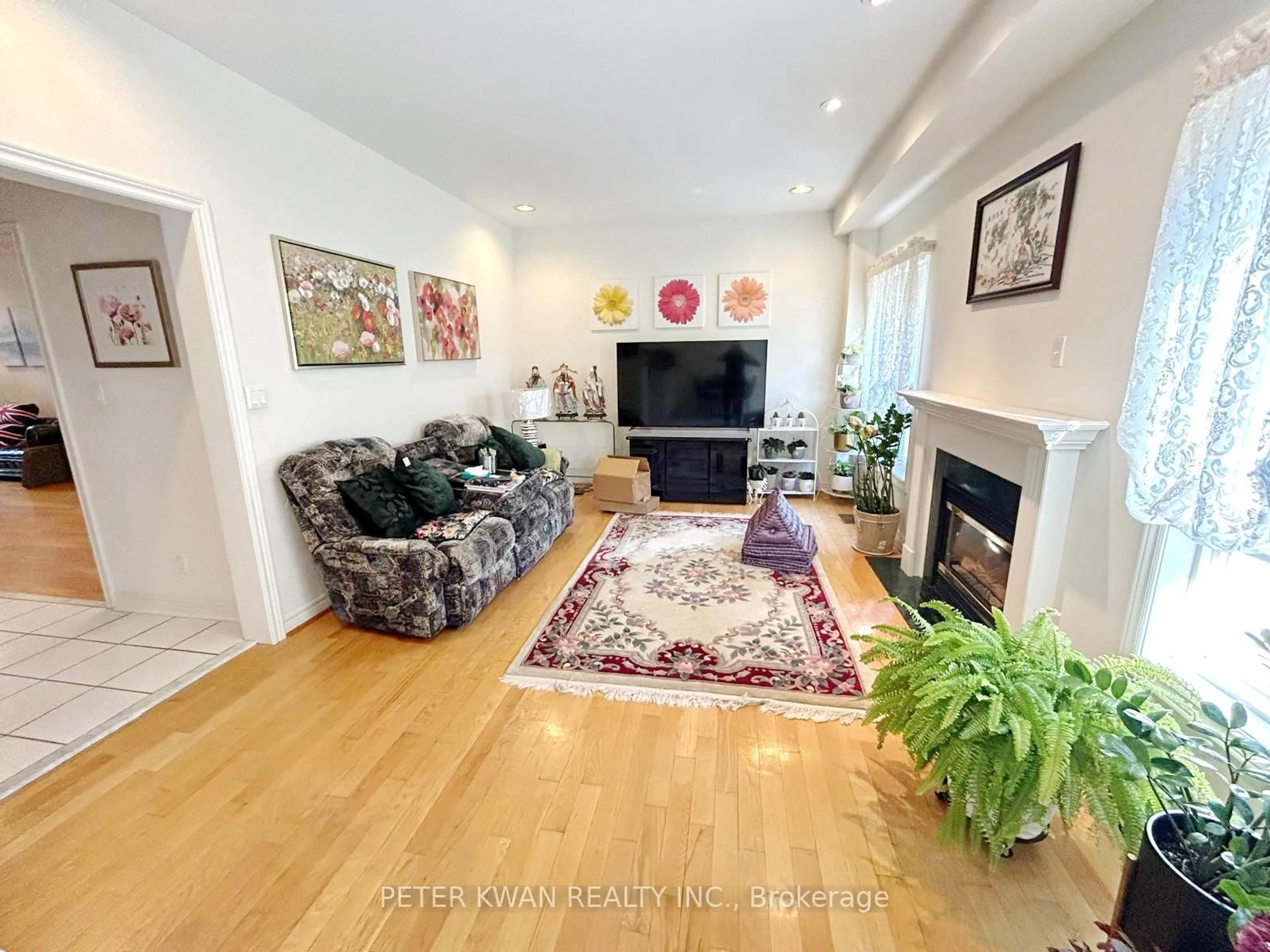 Living room with furniture, wood/laminate floor for 231 Pinewood Dr, Vaughan Ontario L4J 5R7