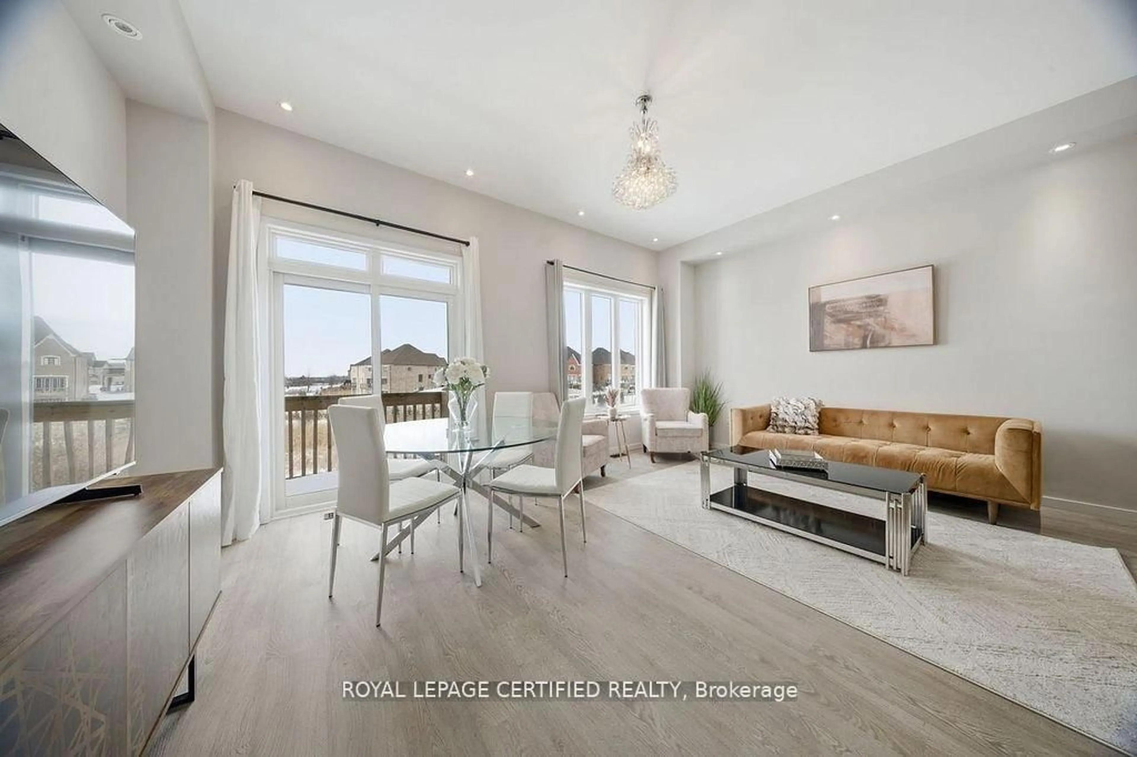 Living room with furniture, wood/laminate floor for 240 Elyse Crt, Aurora Ontario L4G 2C9