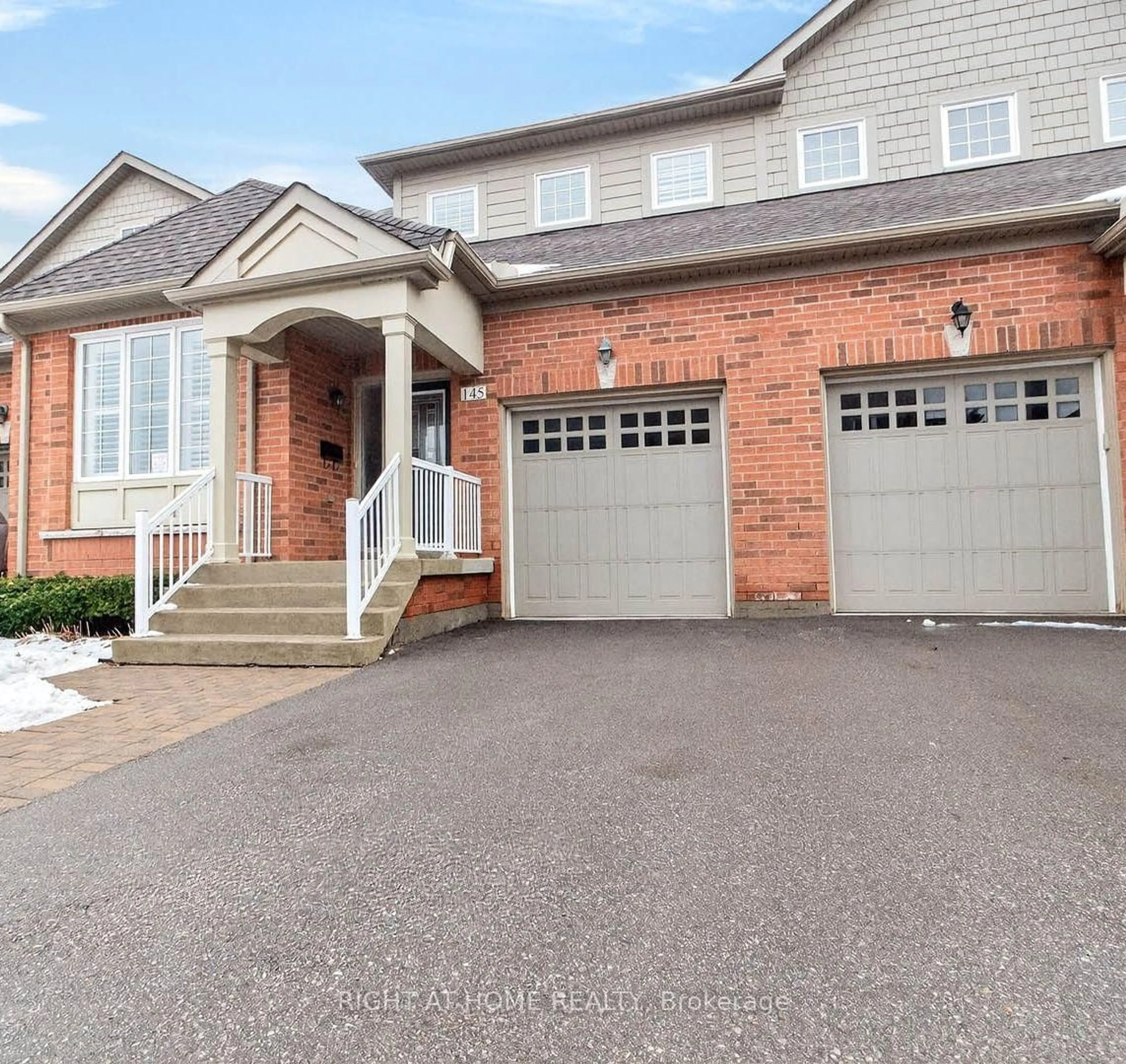 Home with brick exterior material, street for 145 Louisbourg Way, Markham Ontario L6E 2A2