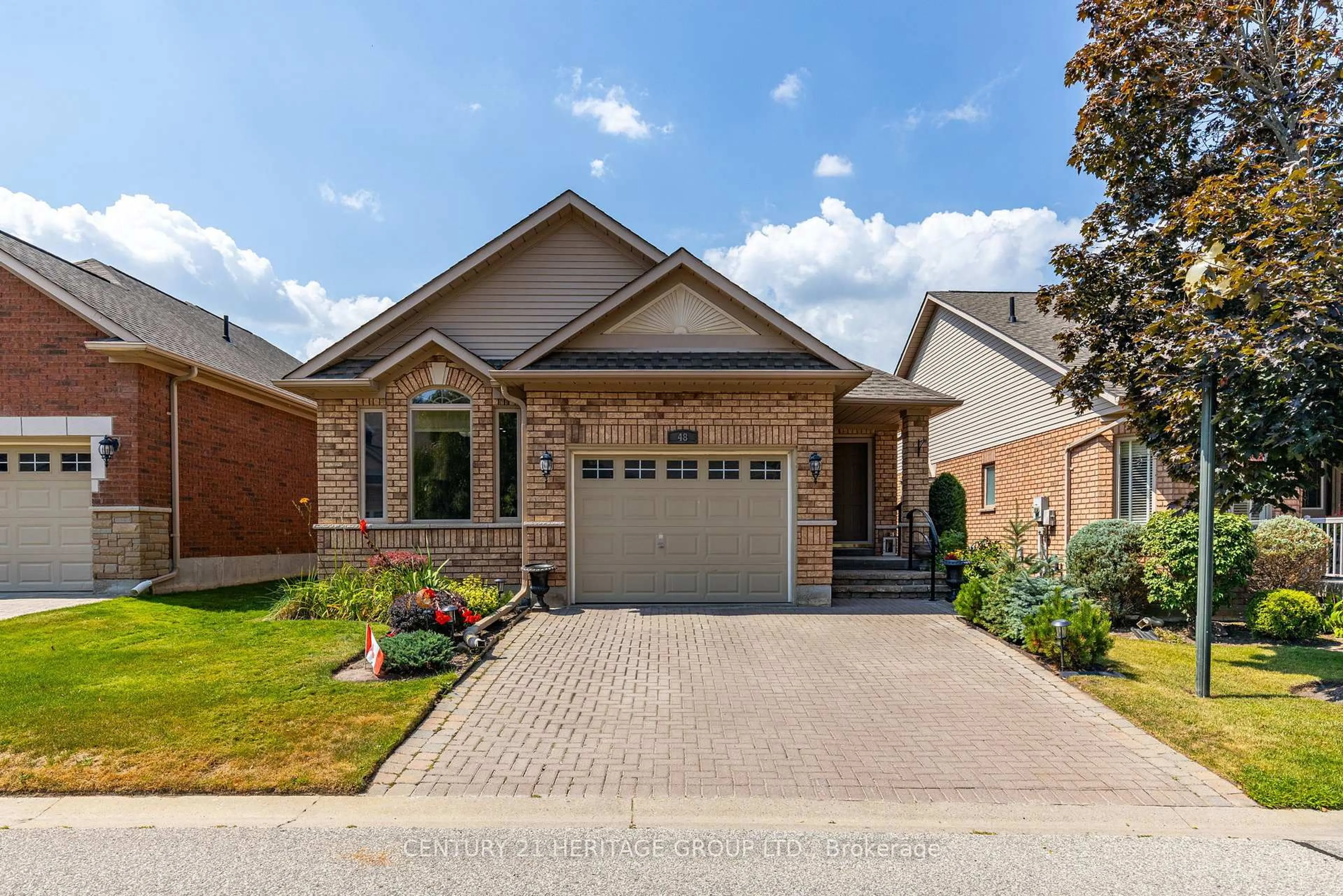 Home with brick exterior material, street for 48 Sunset Blvd #3, New Tecumseth Ontario L9R 1Z5
