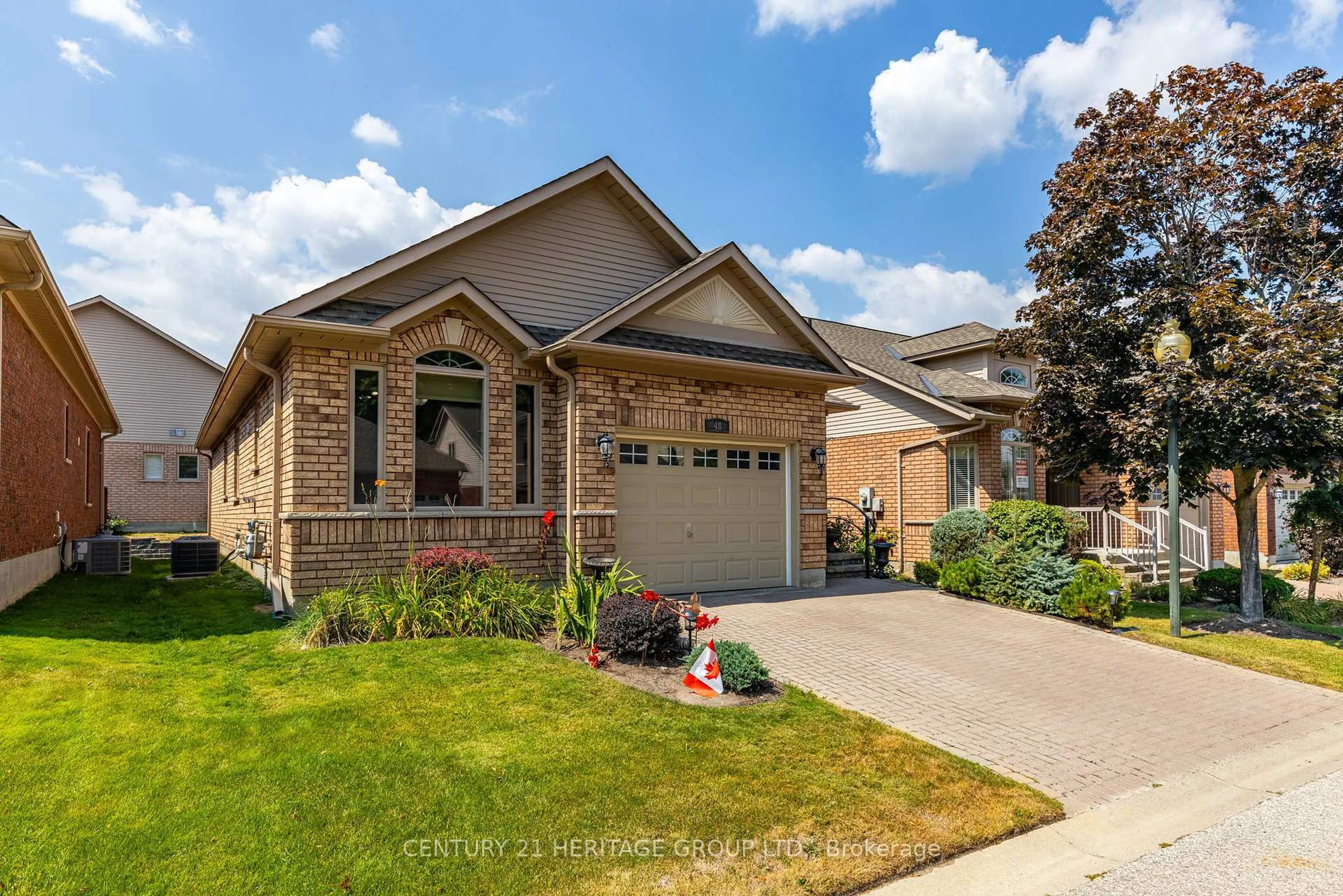 Home with brick exterior material, street for 48 Sunset Blvd #3, New Tecumseth Ontario L9R 1Z5