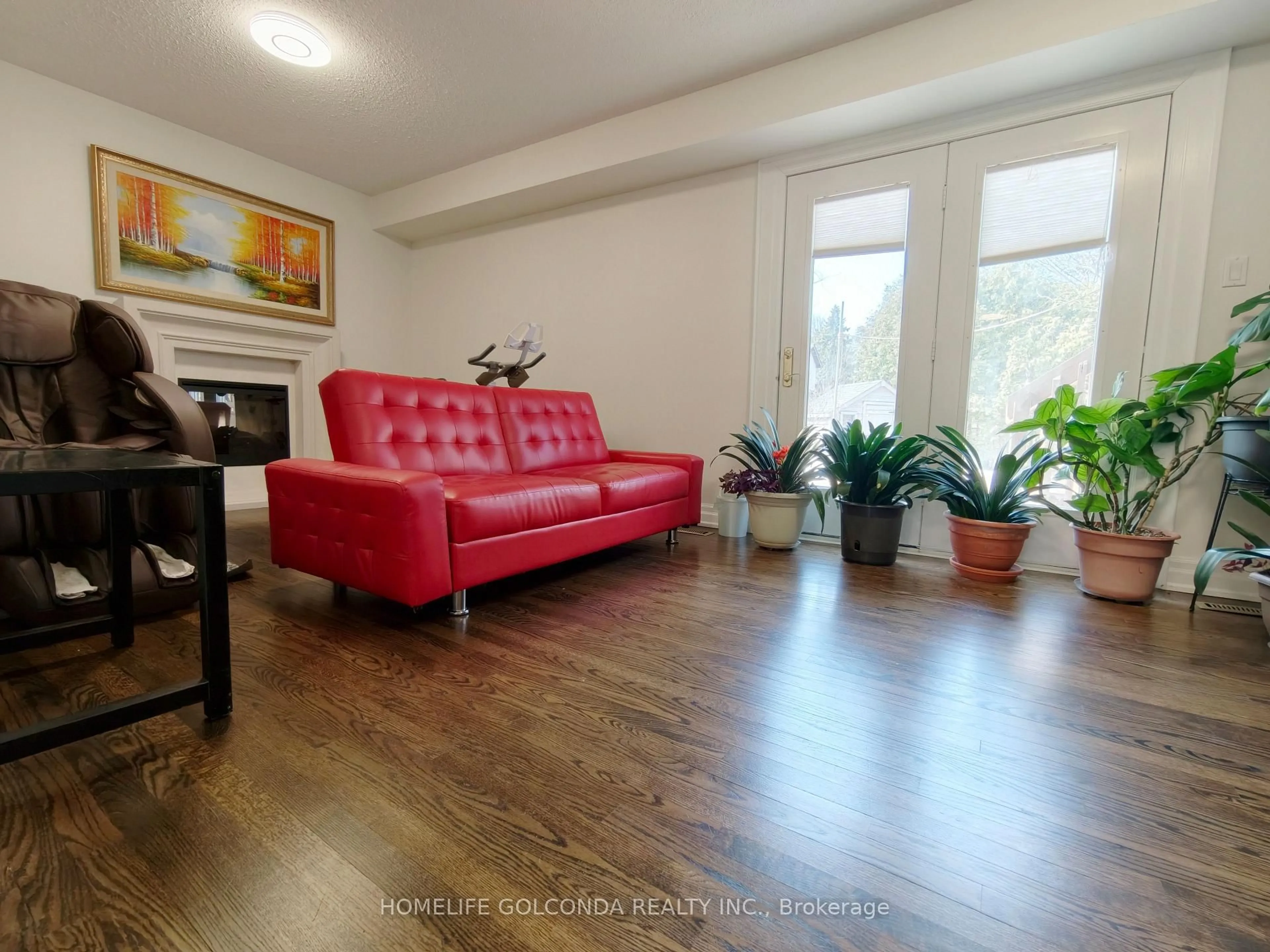 Living room with furniture, wood/laminate floor for 6 Summerfeldt Cres, Markham Ontario L3R 2B2