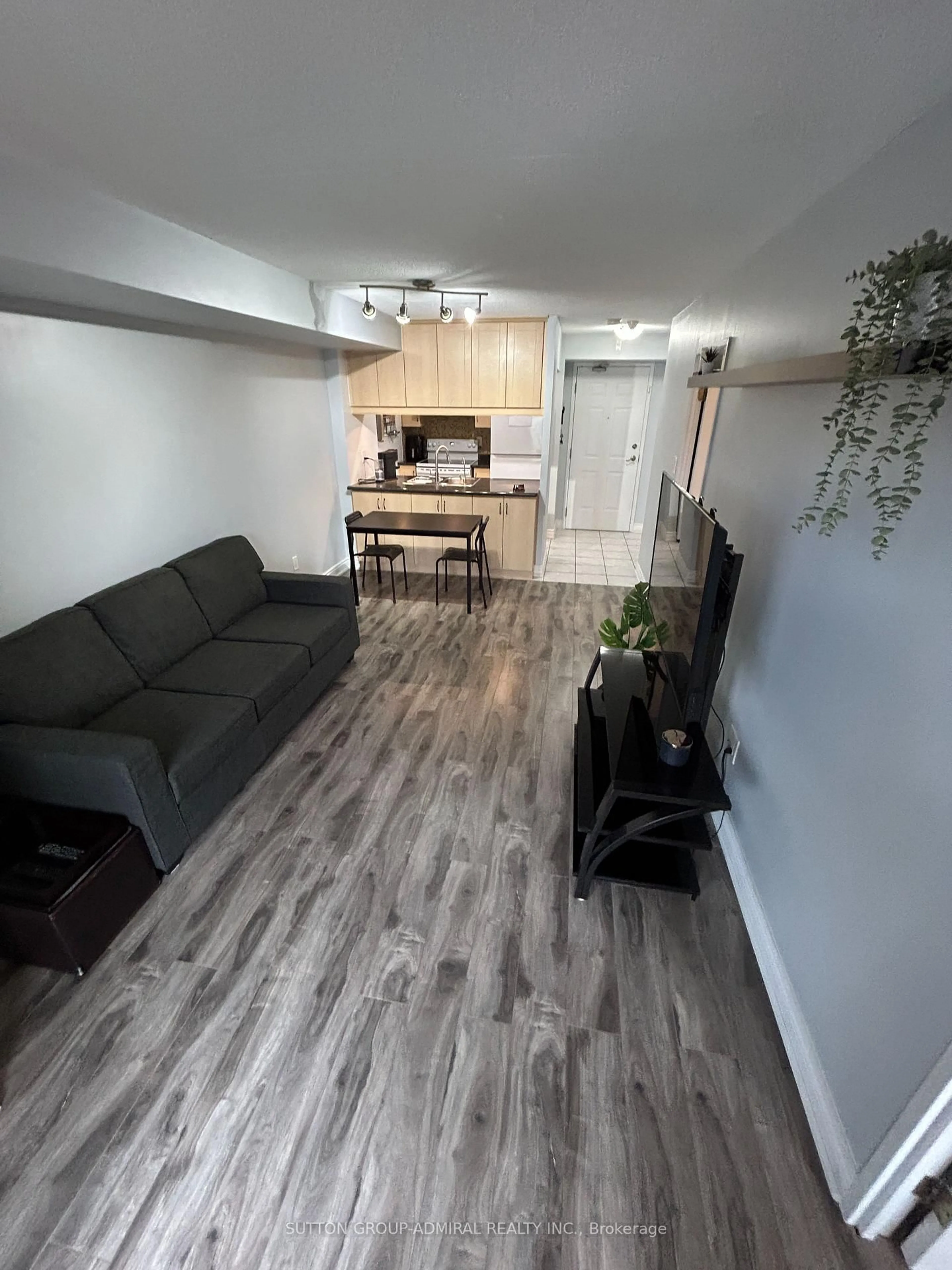 Living room with furniture, wood/laminate floor for 250 Pine Grove Rd #216, Vaughan Ontario L4L 9M6