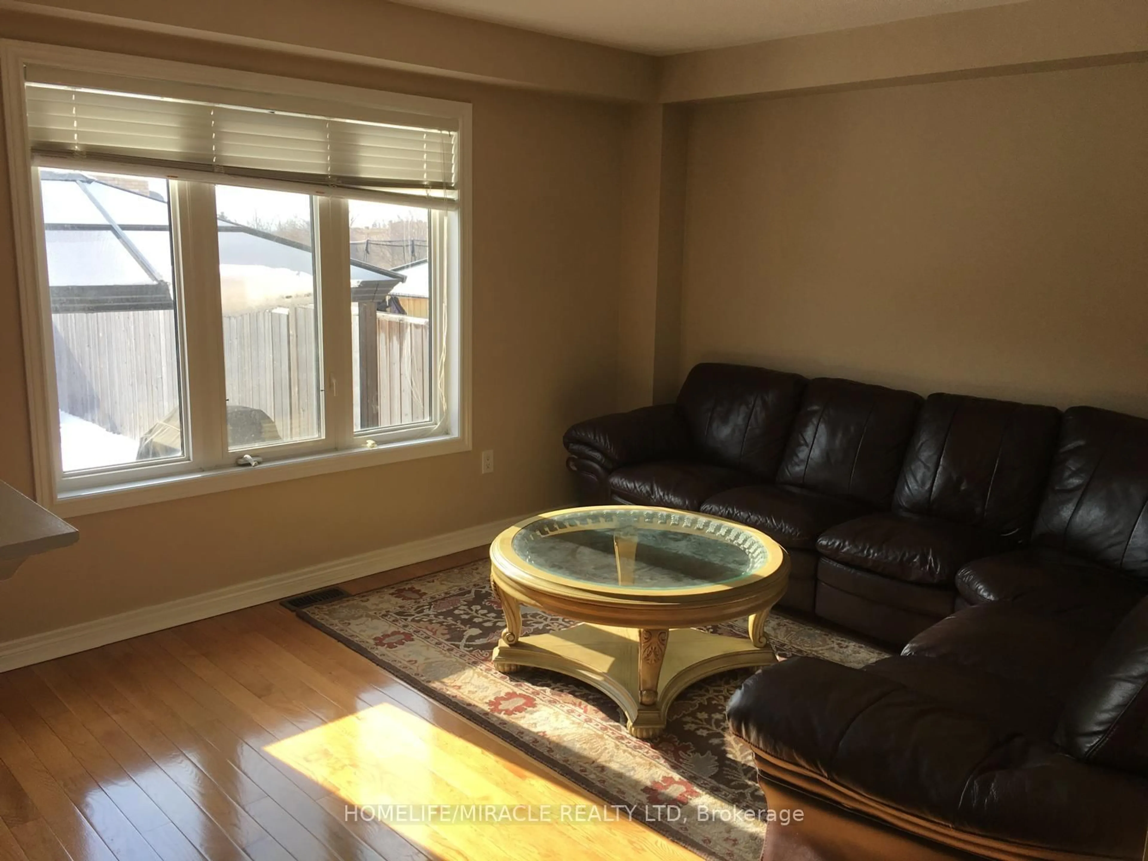 Living room with furniture, wood/laminate floor for 191 Petticoat Rd, Vaughan Ontario L6A 0M1