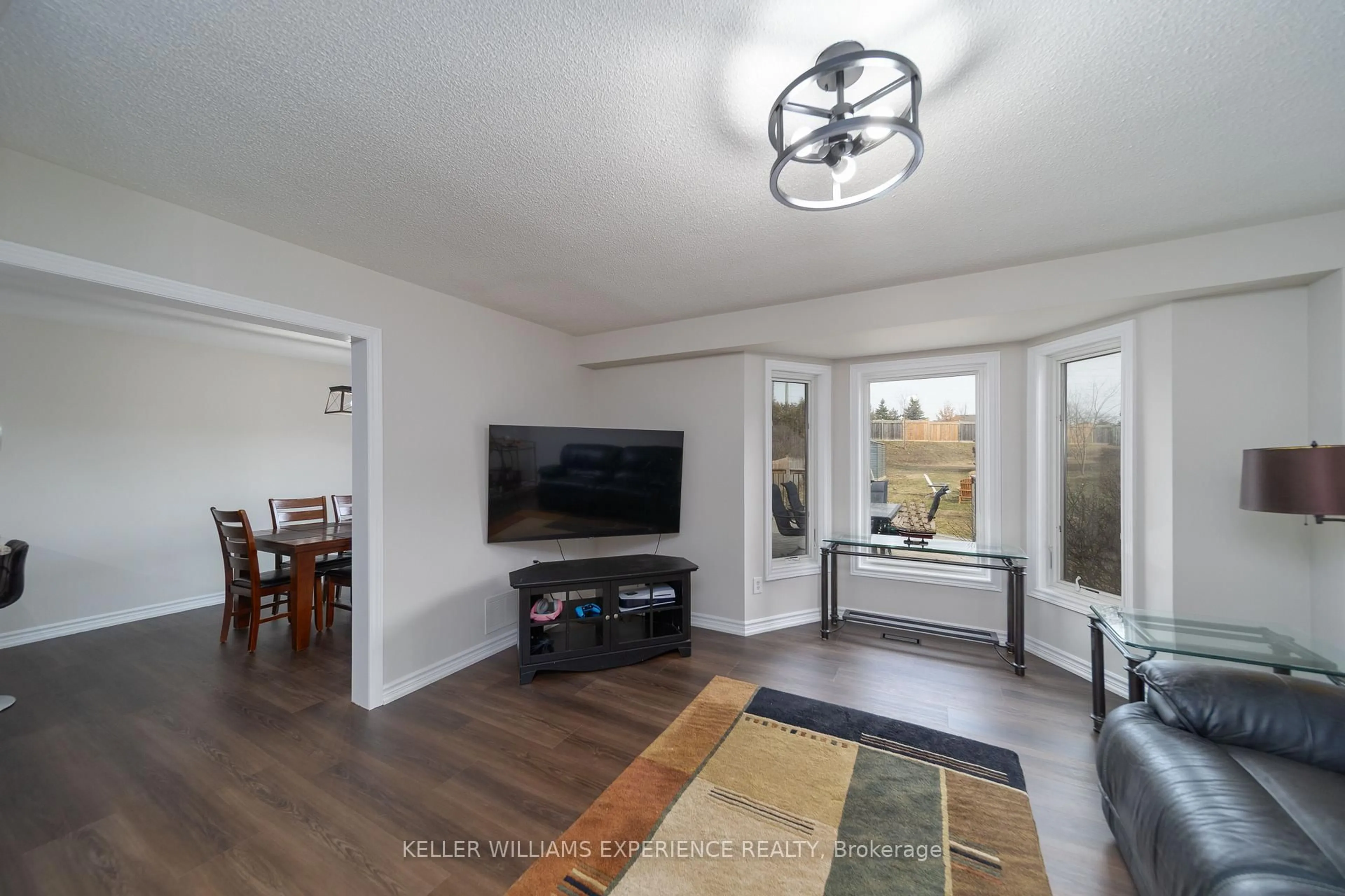 Living room with furniture, wood/laminate floor for 599 Walpole Cres, Newmarket Ontario L3X 2B5