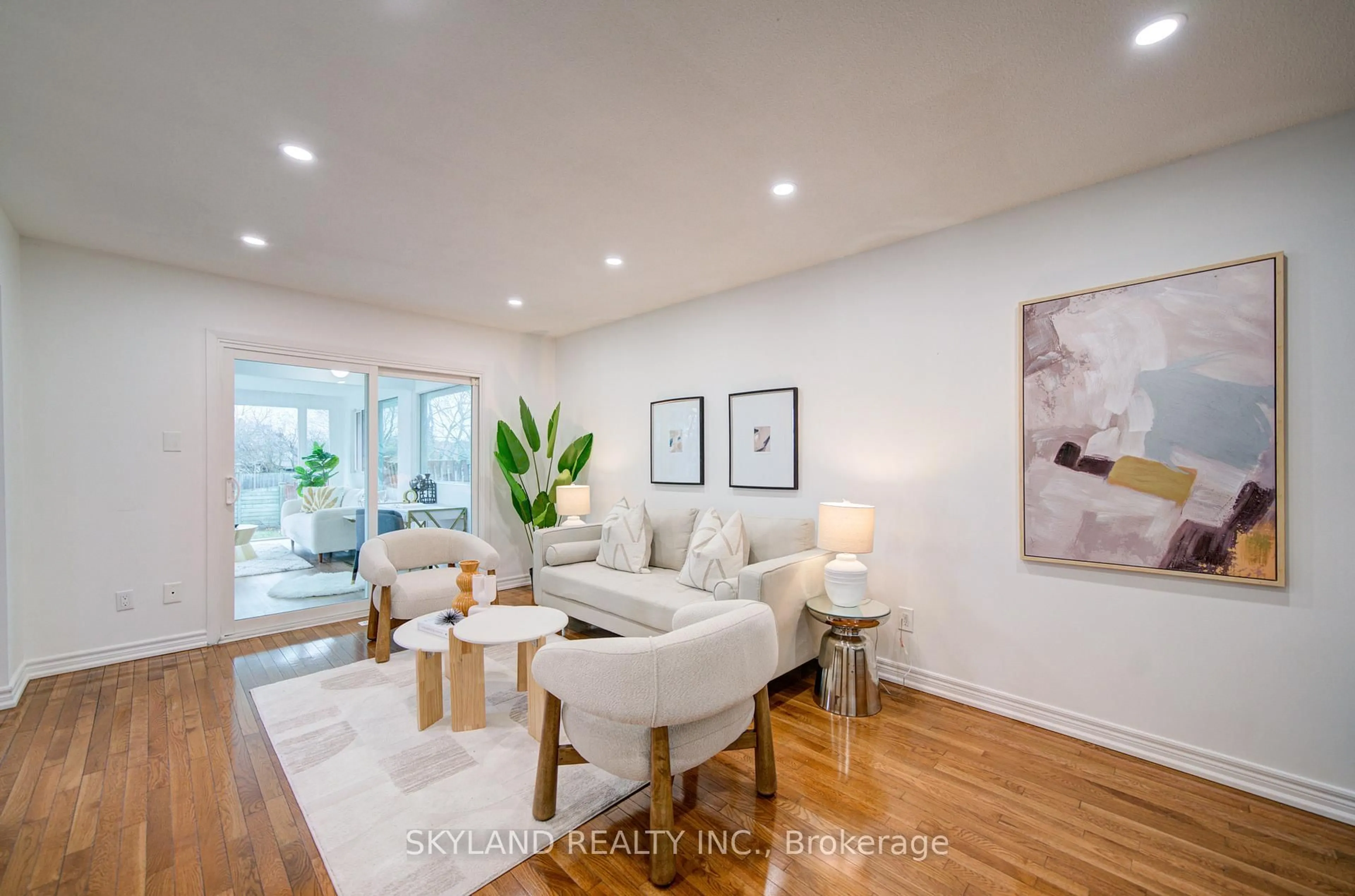 Living room with furniture, wood/laminate floor for 56 Upton Cres, Markham Ontario L3R 3T4