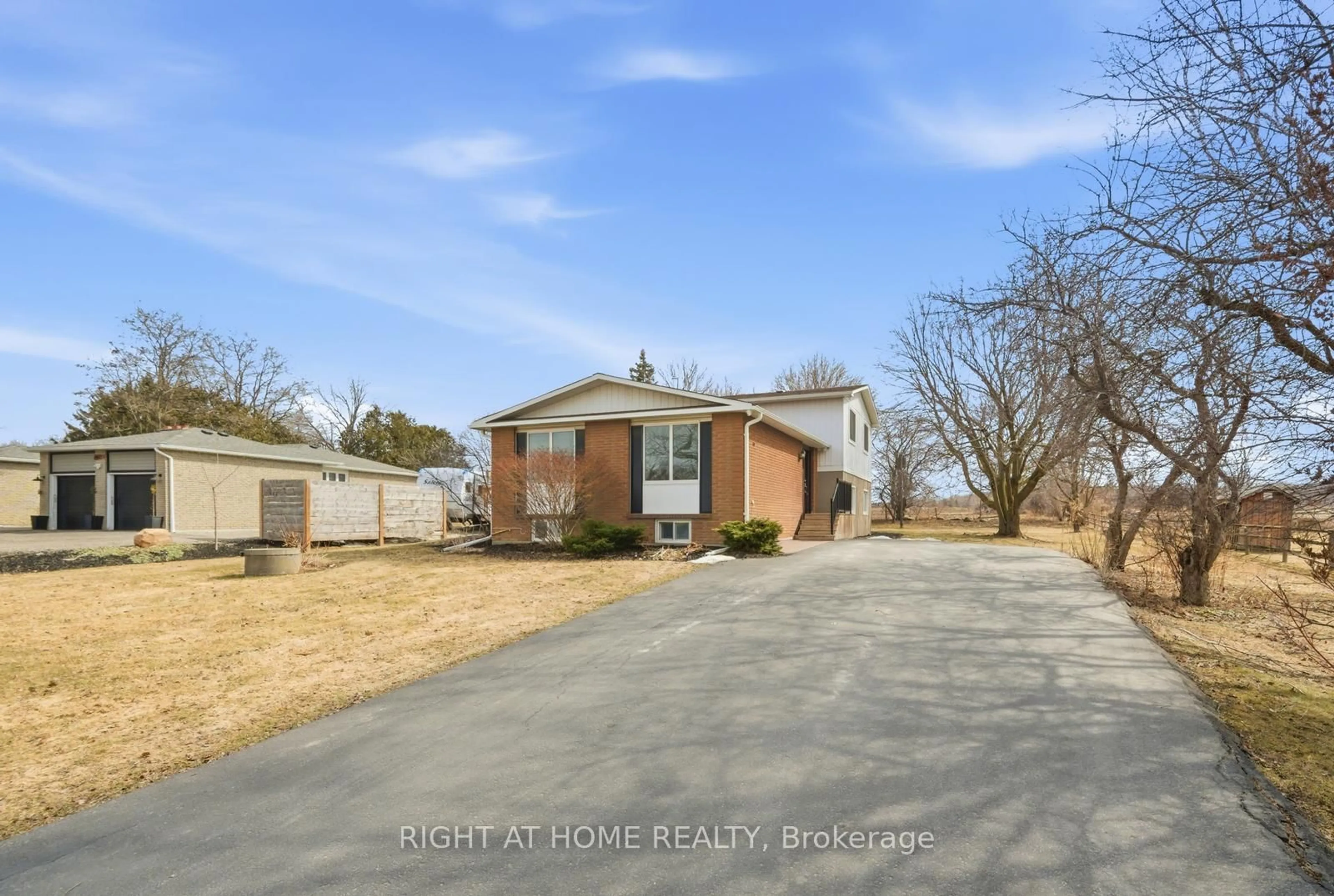A pic from outside/outdoor area/front of a property/back of a property/a pic from drone, street for 5885 7th Line, New Tecumseth Ontario L0G 1A0