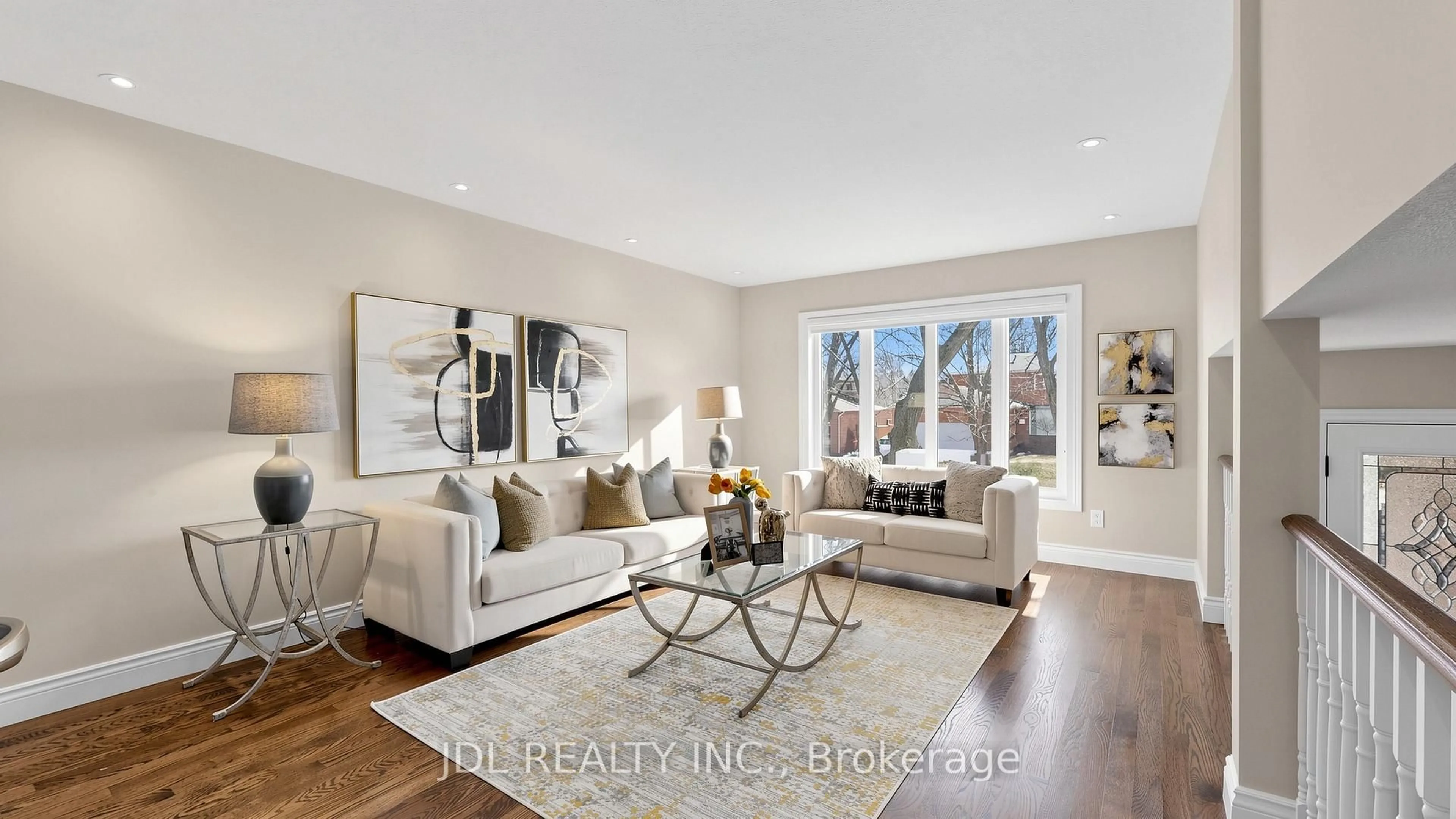 Living room with furniture, wood/laminate floor for 16 Breckonwood Cres, Markham Ontario L3T 5E8