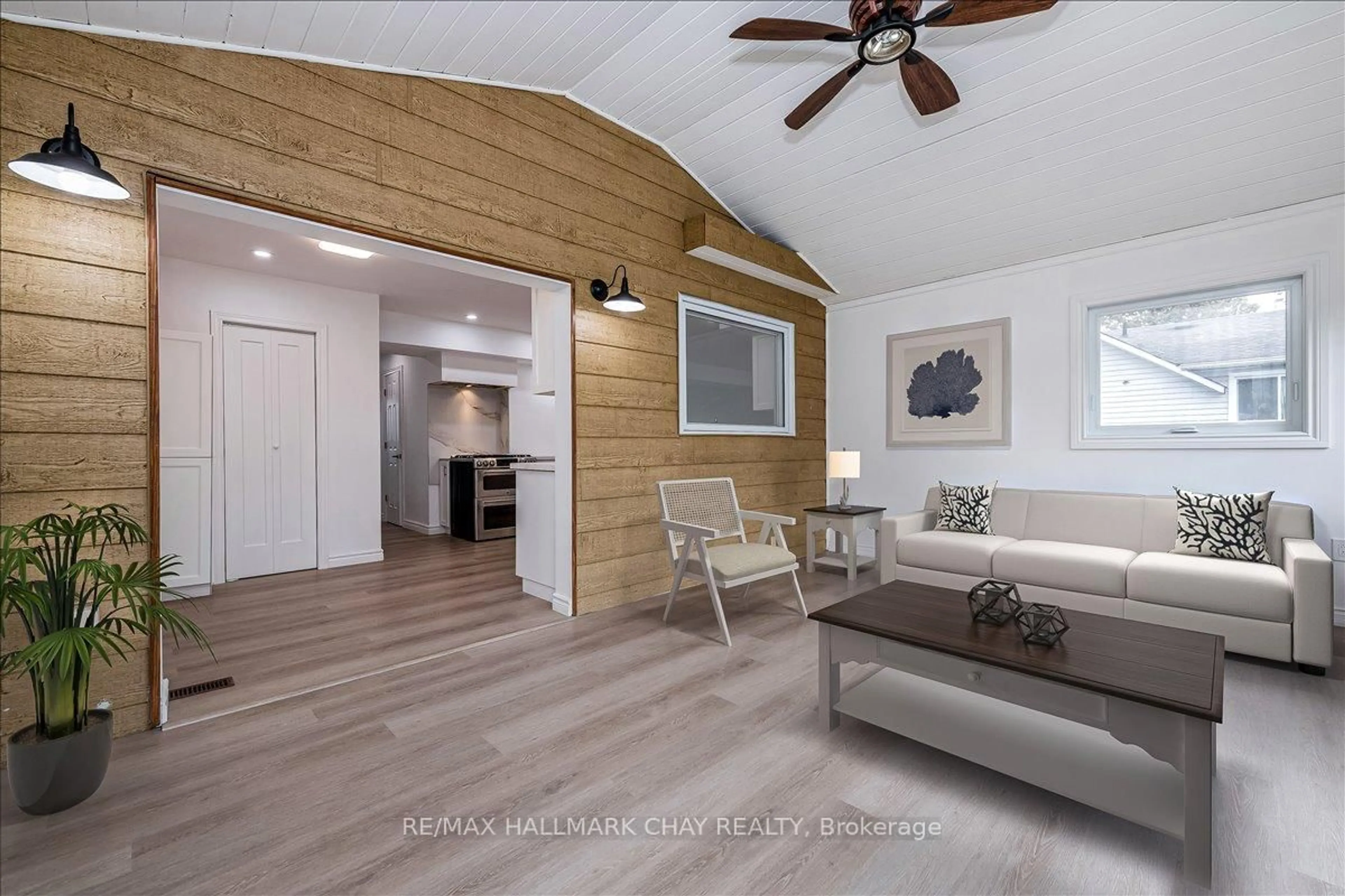 Living room with furniture, wood/laminate floor for 1063 WOOD St, Innisfil Ontario L0L 1K0