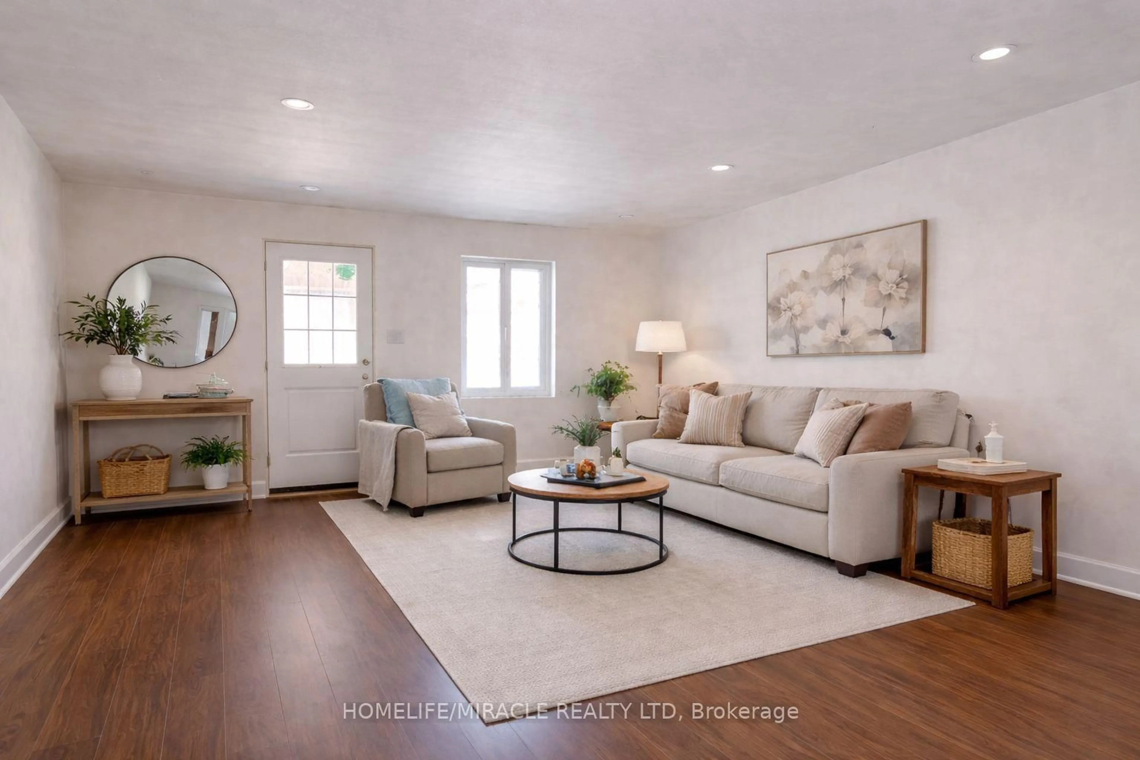 Living room with furniture, wood/laminate floor for 4555 14th Ave, Markham Ontario L3S 3K2