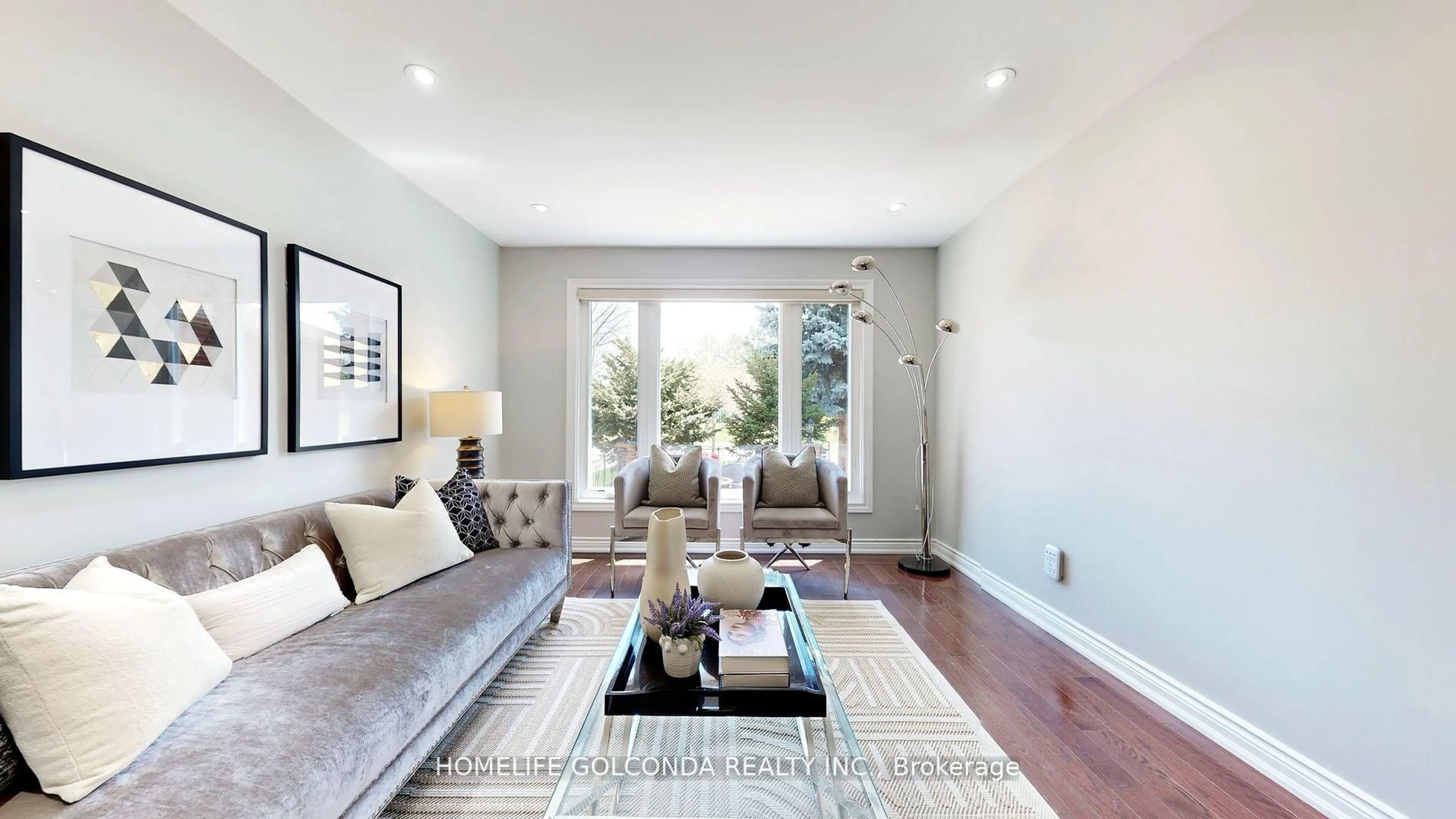 Living room with furniture, wood/laminate floor for 310 Airdrie Dr, Vaughan Ontario L4L 3B9