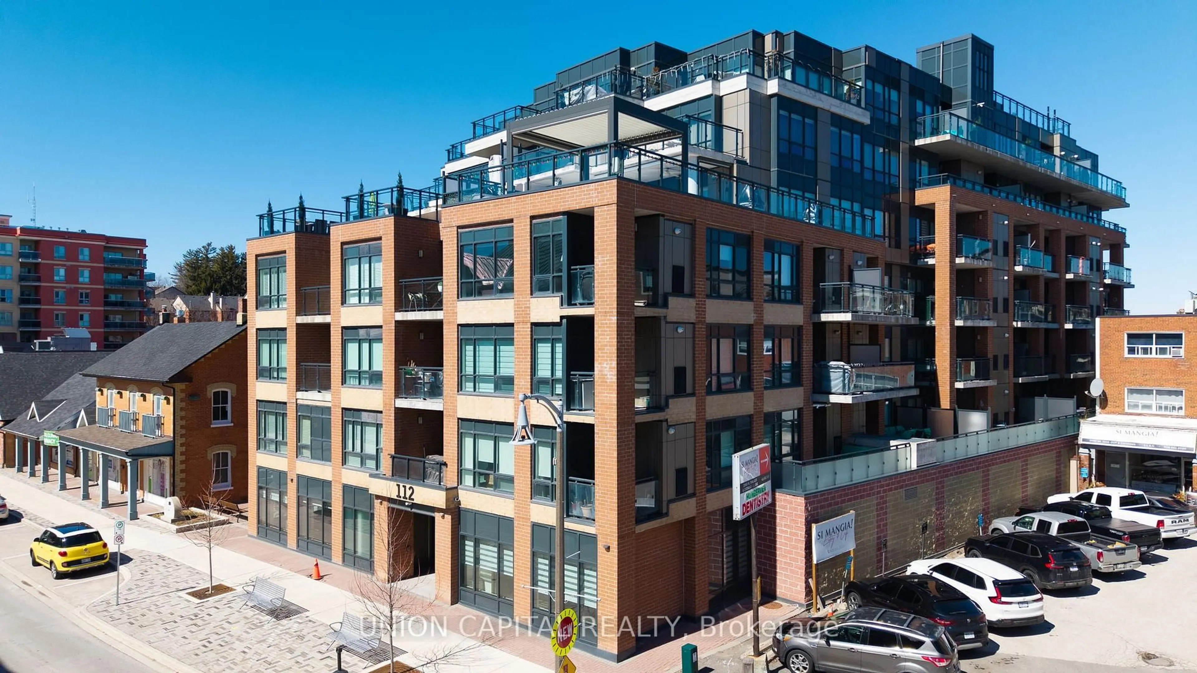 A pic from outside/outdoor area/front of a property/back of a property/a pic from drone, unknown for 112 Woodbridge Ave #412, Vaughan Ontario L4L 2S7