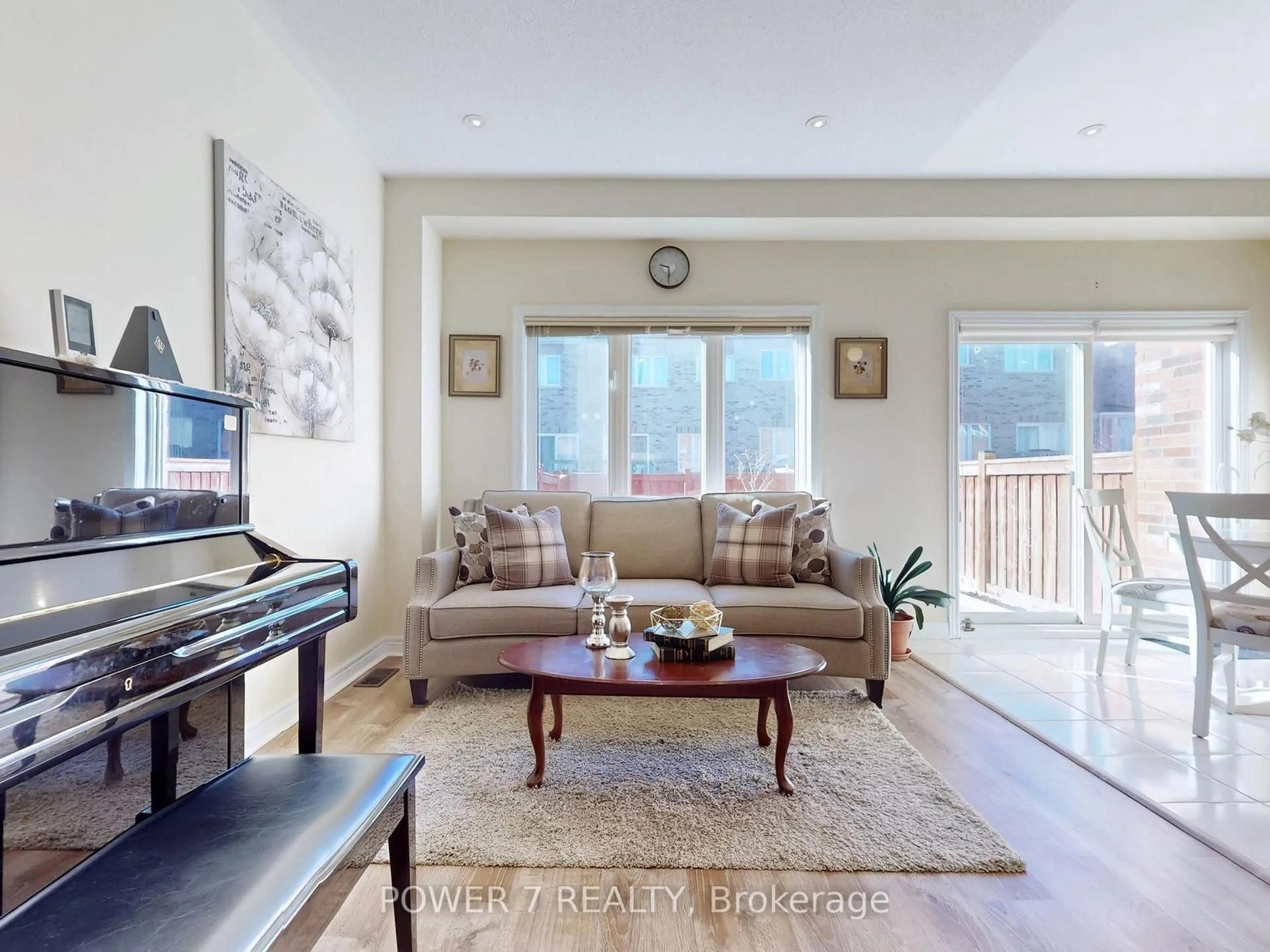 Living room with furniture, wood/laminate floor for 25 Black Locust Dr, Markham Ontario L6E 0P8