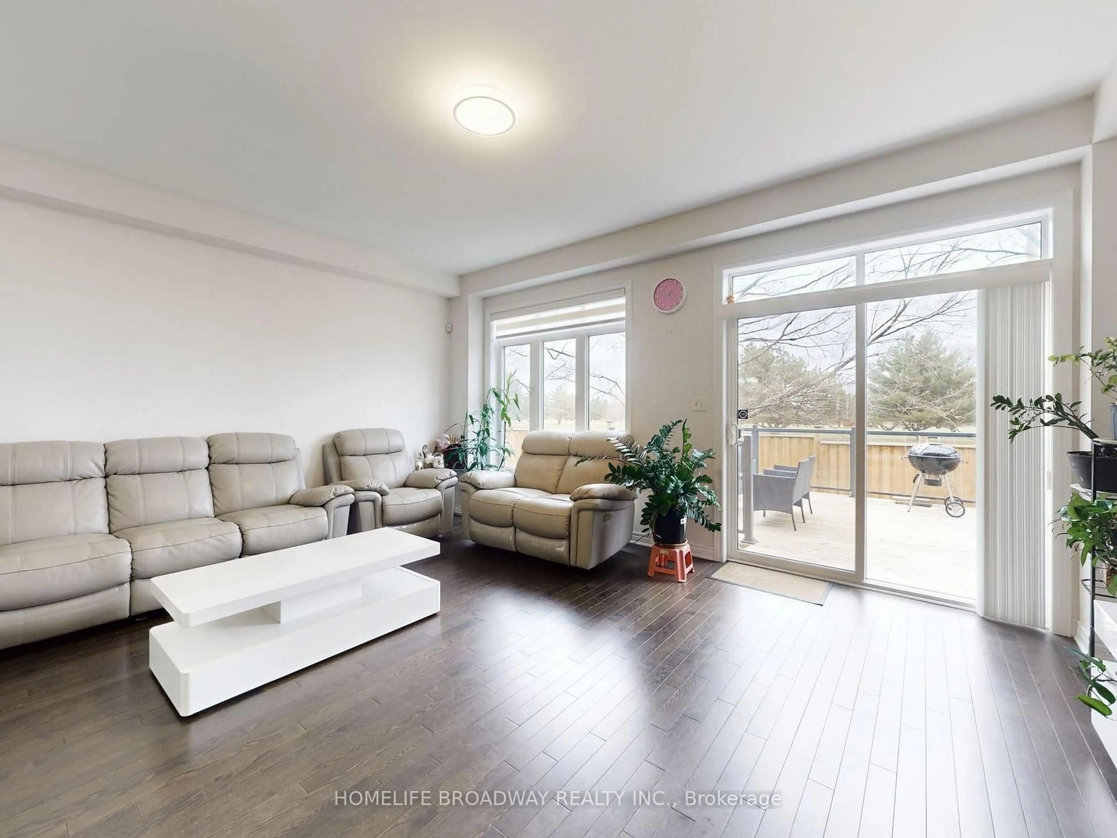 Living room with furniture, wood/laminate floor for 43 Titan Tr, Markham Ontario L3S 0E2