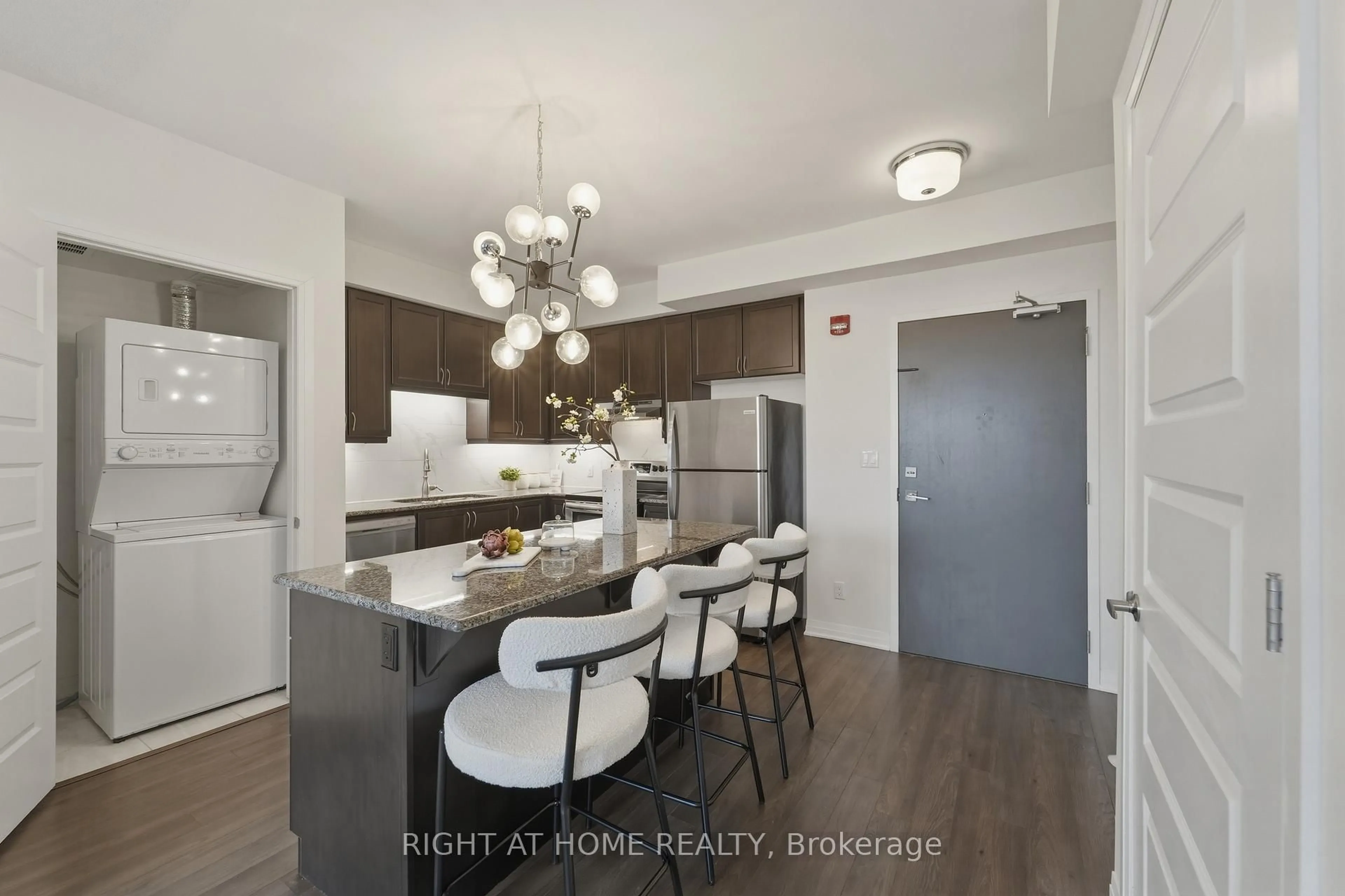 Open concept kitchen, wood/laminate floor for 2 Adam Sellers St #503, Markham Ontario L6B 1P2