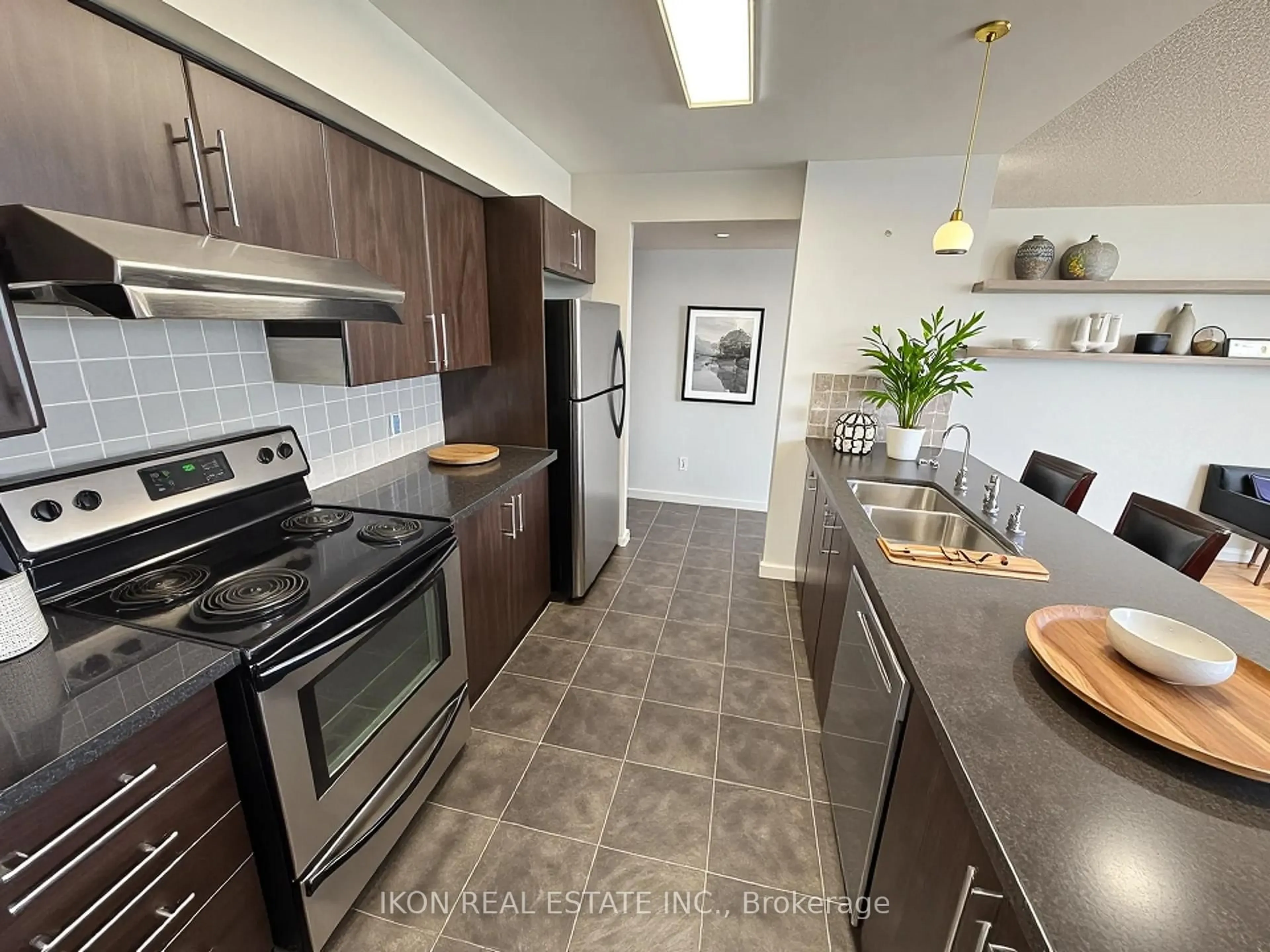 Open concept kitchen, ceramic/tile floor for 7373 Kennedy Rd #701, Markham Ontario L3R 1H6