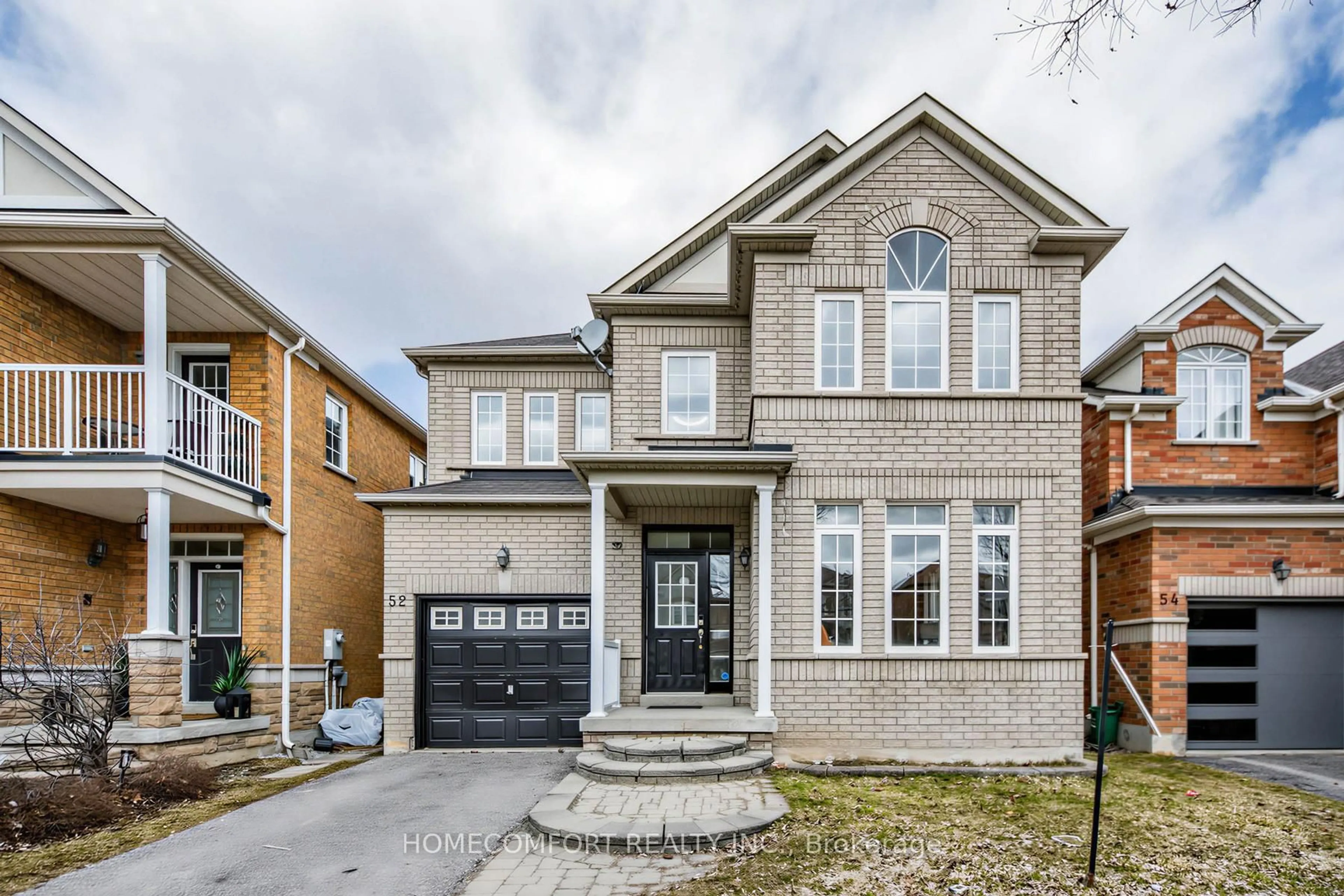 Home with brick exterior material, street for 52 Victoria Wood Ave, Markham Ontario L6E 1K1