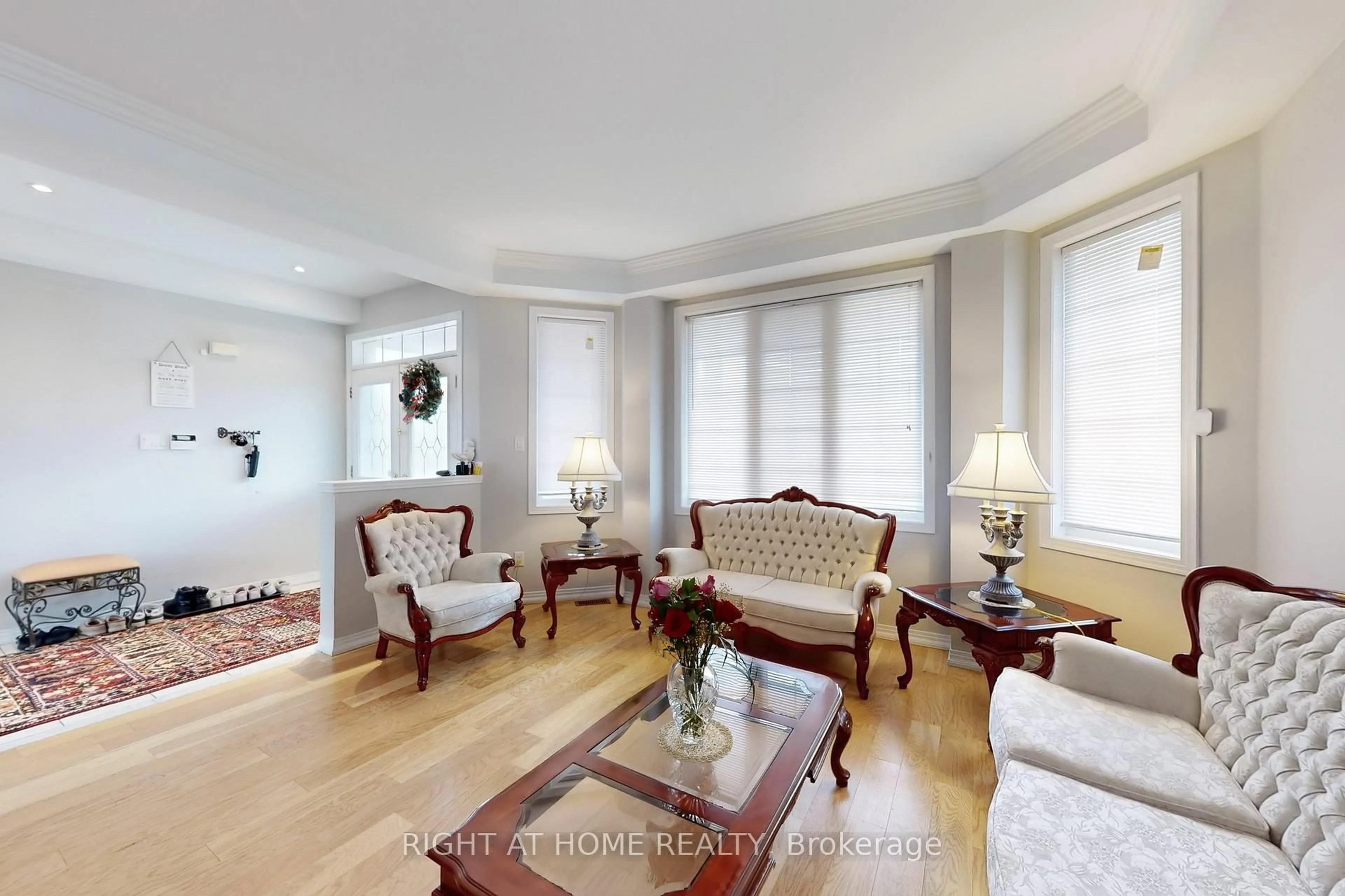 Living room with furniture, wood/laminate floor for 19 Robert Grundy Rd, Markham Ontario L6C 3A5