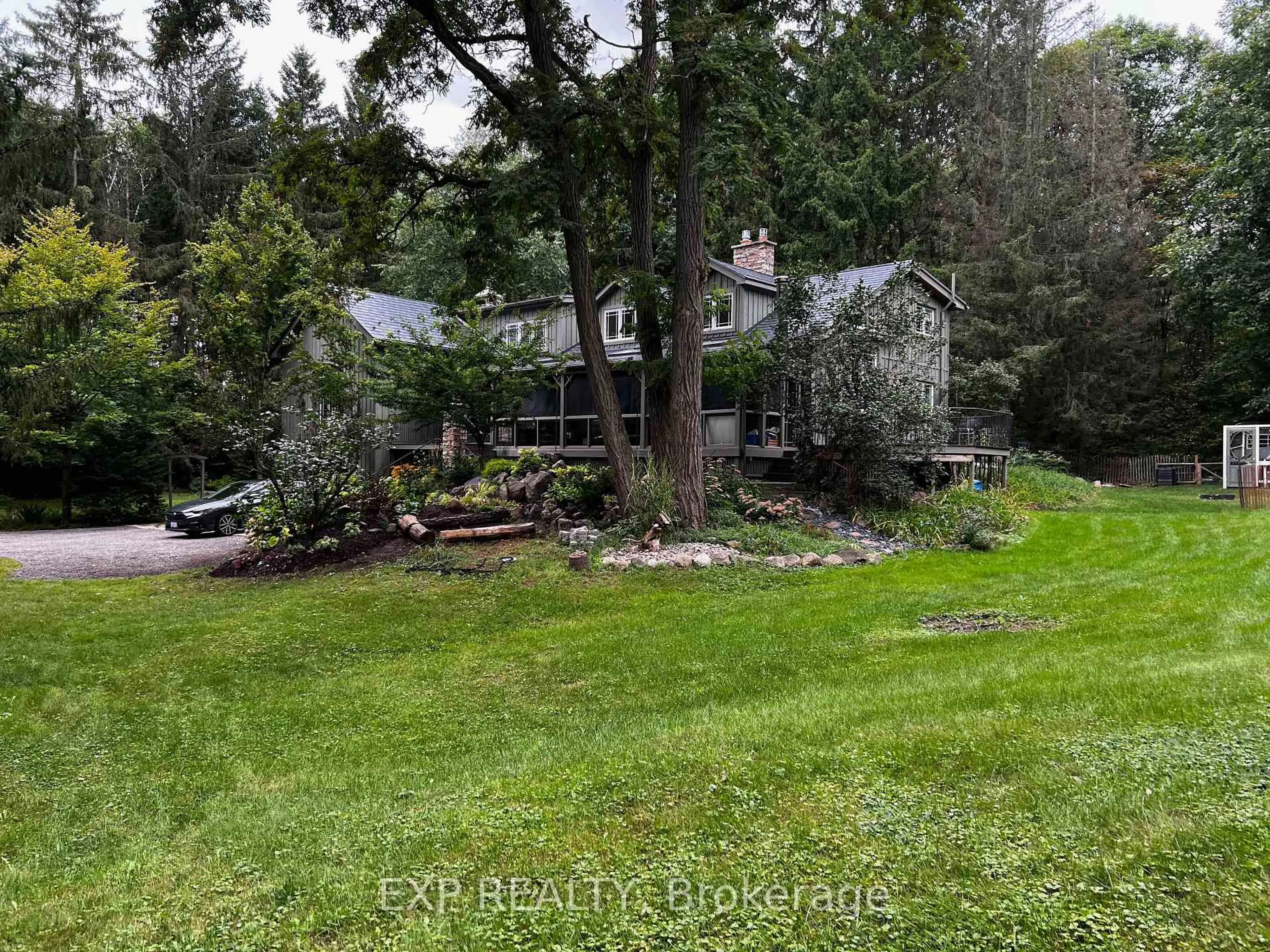 A pic from outside/outdoor area/front of a property/back of a property/a pic from drone, forest/trees view for 115 Fog Rd, King Ontario L7B 1A3