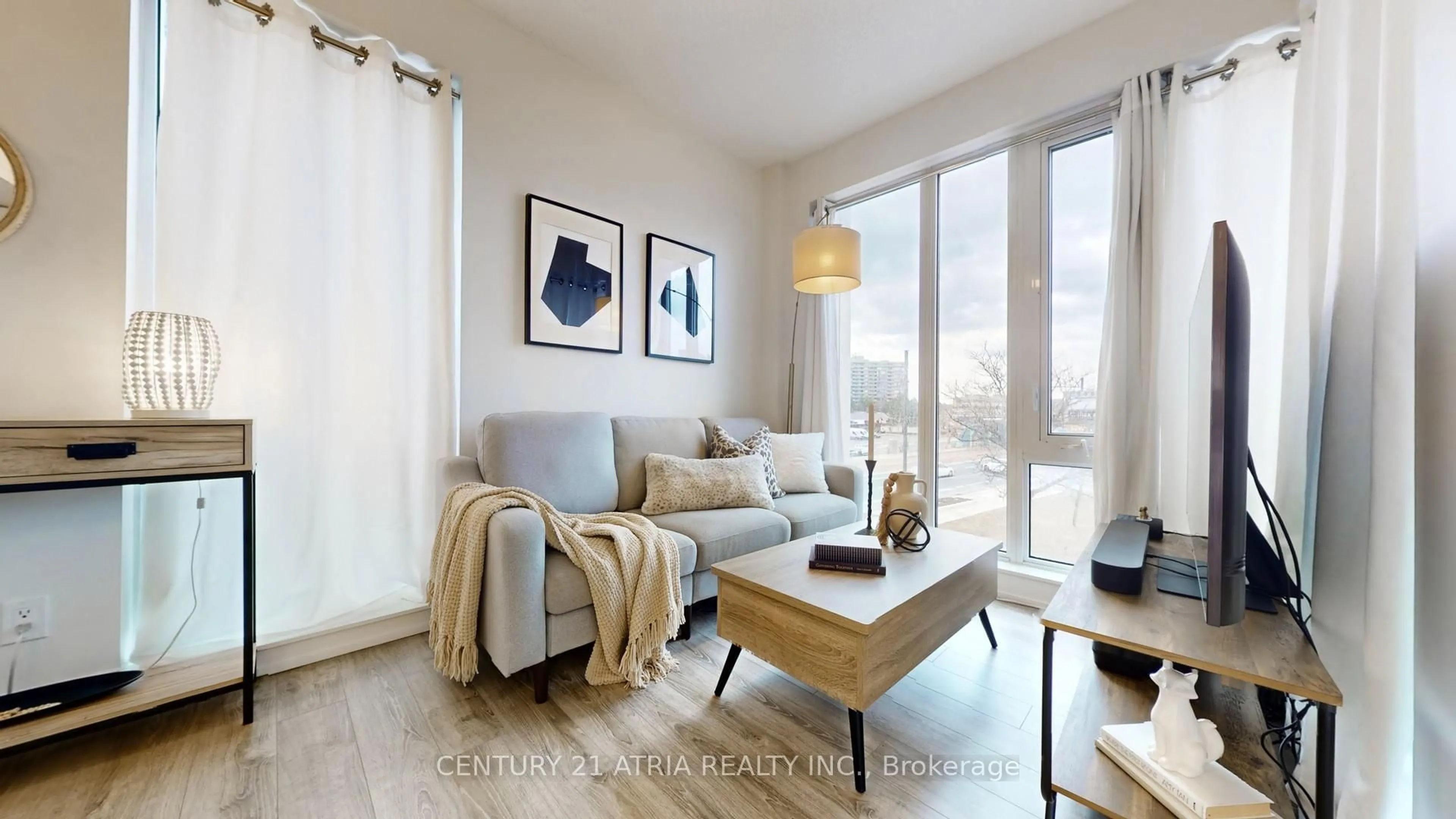 Living room with furniture, wood/laminate floor for 9600 Yonge St #207, Richmond Hill Ontario L4C 0X3