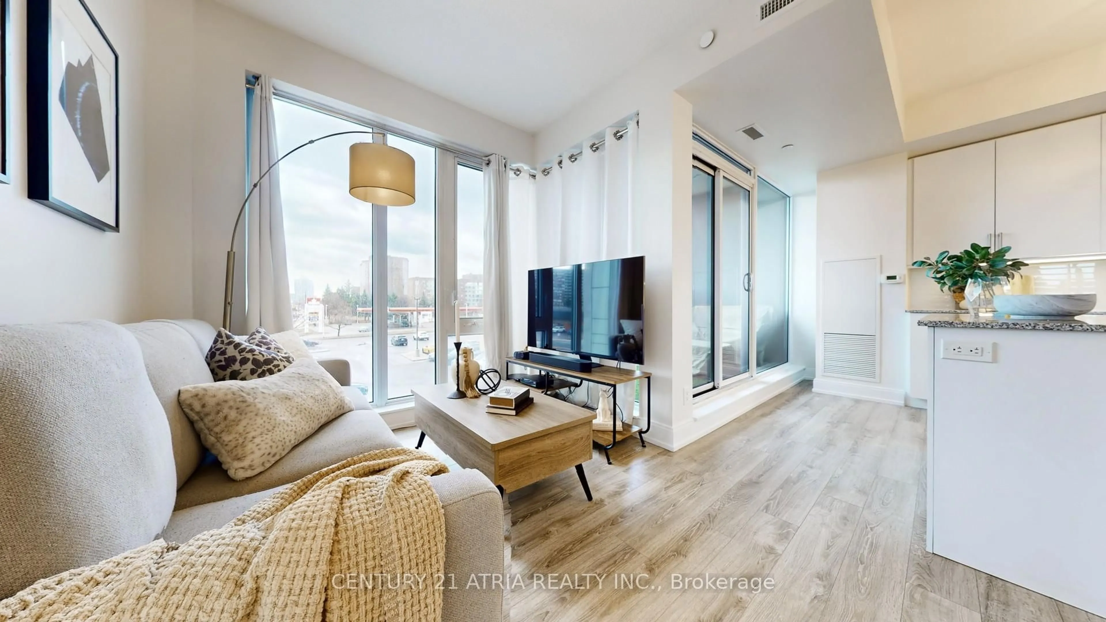 Living room with furniture, wood/laminate floor for 9600 Yonge St #207, Richmond Hill Ontario L4C 0X3