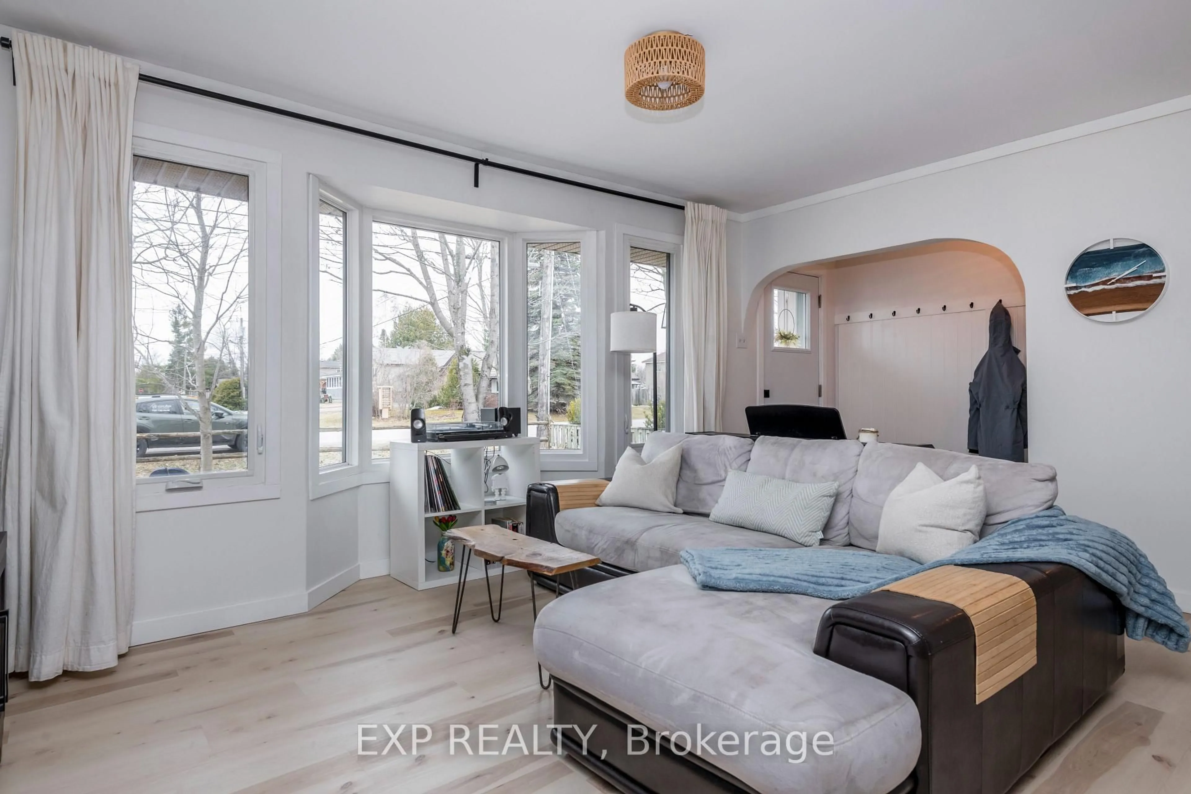 Living room with furniture, wood/laminate floor for 678 Rose Lane, Innisfil Ontario L9S 2H5