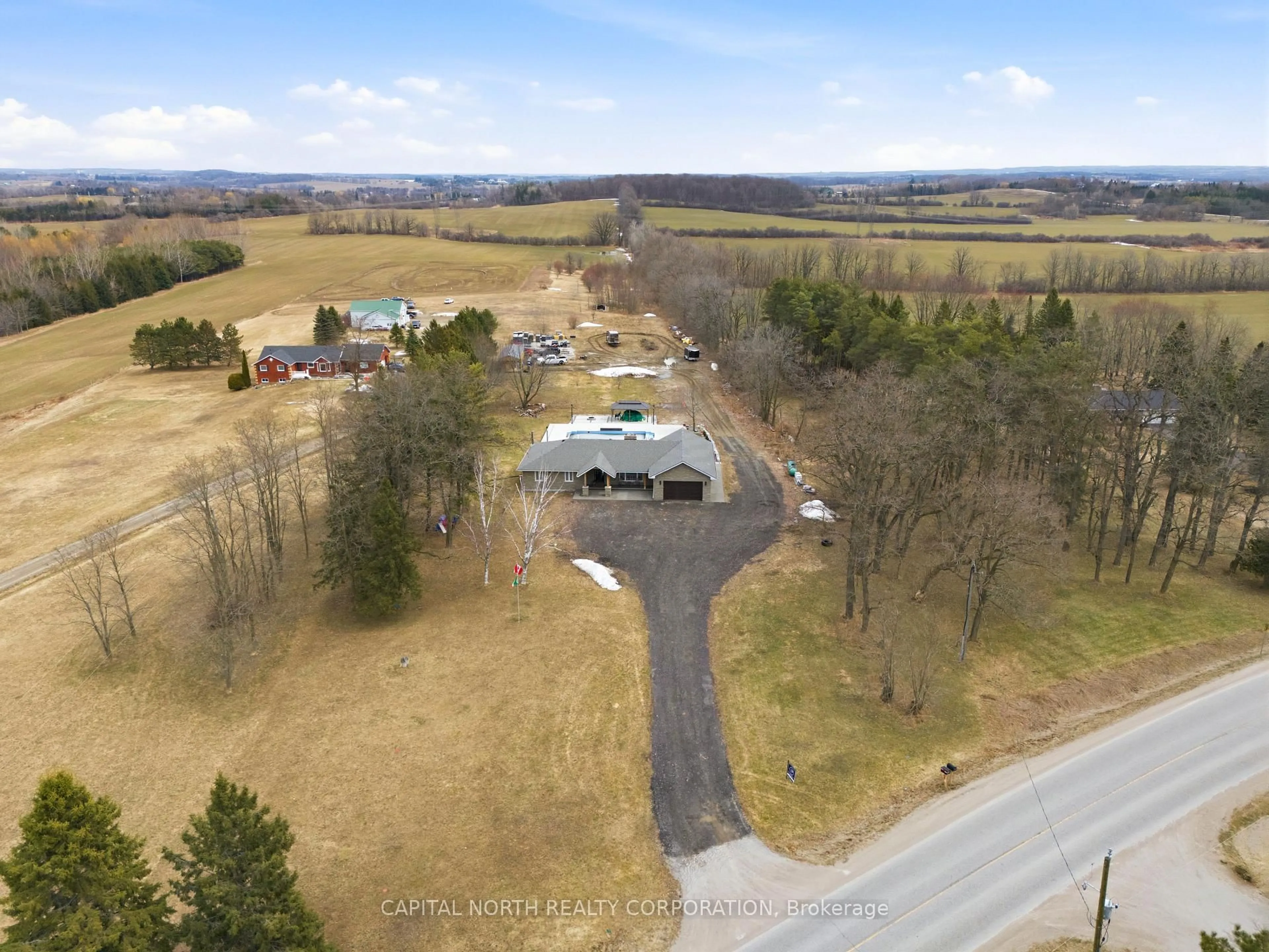 A pic from outside/outdoor area/front of a property/back of a property/a pic from drone, mountain view for 1997 15th Sideroad, New Tecumseth Ontario L0G 1W0