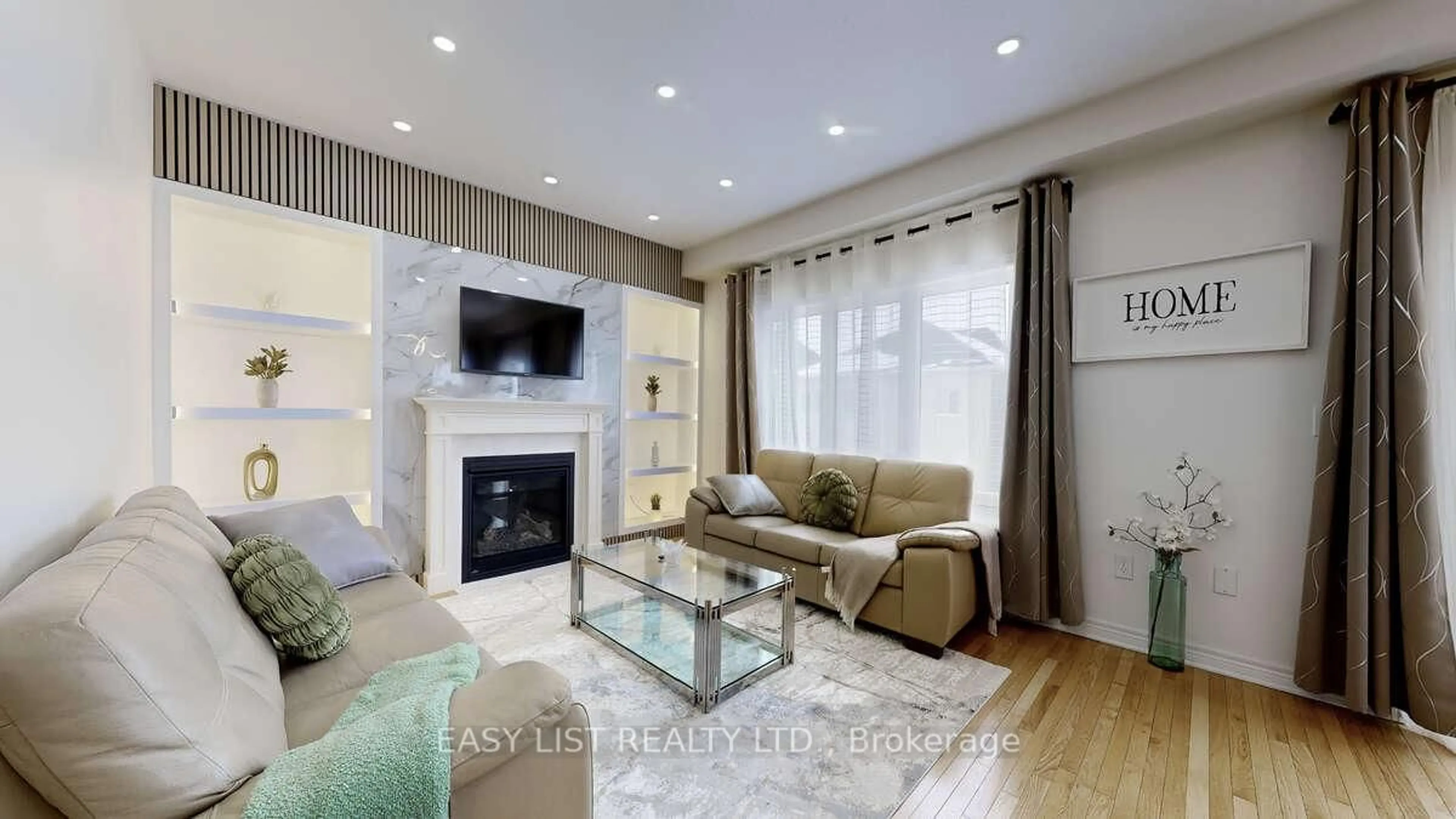 Living room with furniture, wood/laminate floor for 42 Foxberry Rd, East Gwillimbury Ontario L9N 0P6