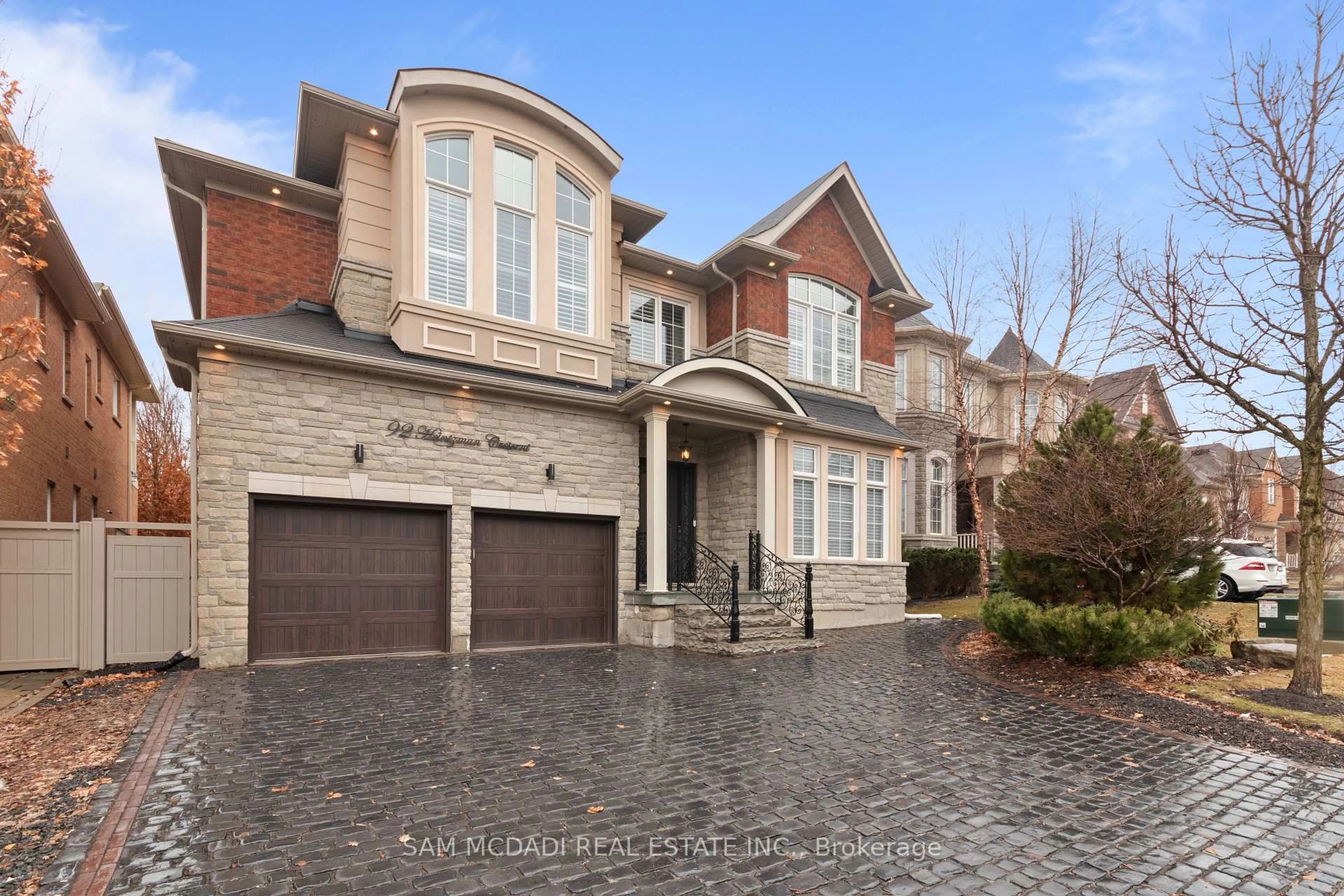 Home with brick exterior material, street for 92 Heintzman Cres, Vaughan Ontario L6A 4T1