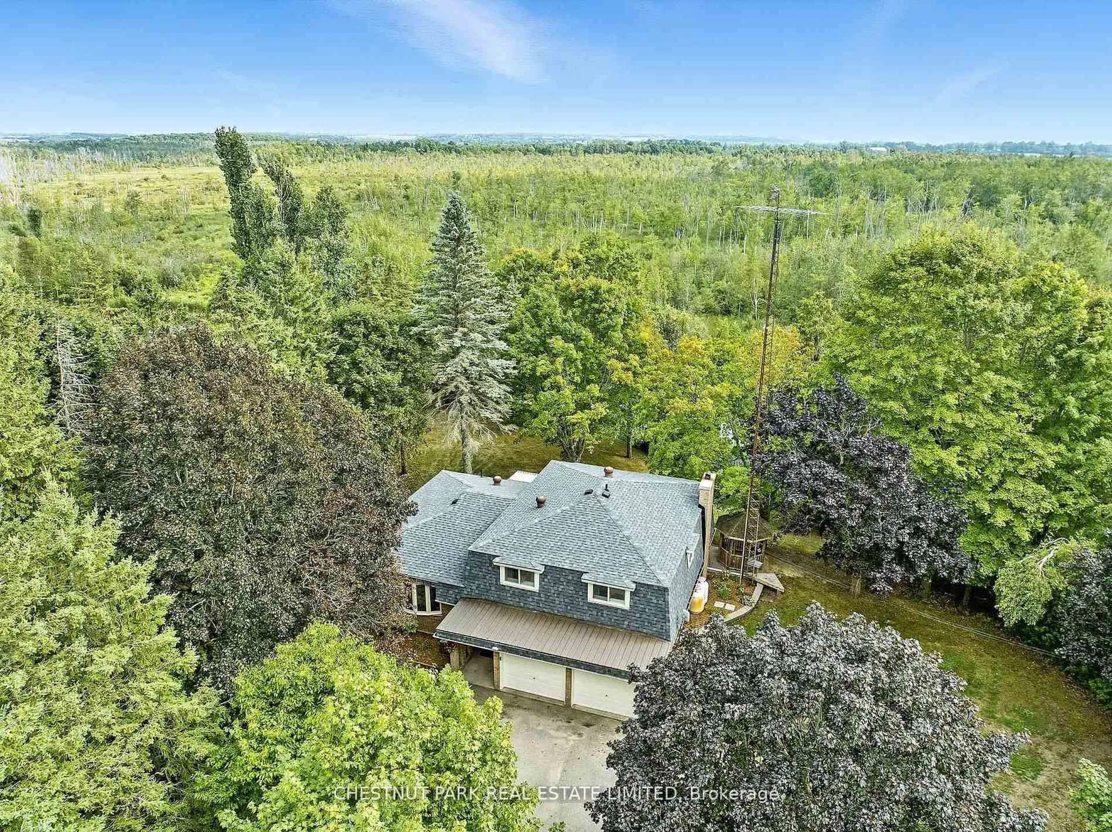A pic from outside/outdoor area/front of a property/back of a property/a pic from drone, forest/trees view for 720 Highway 48, Brock Ontario L0K 1A0