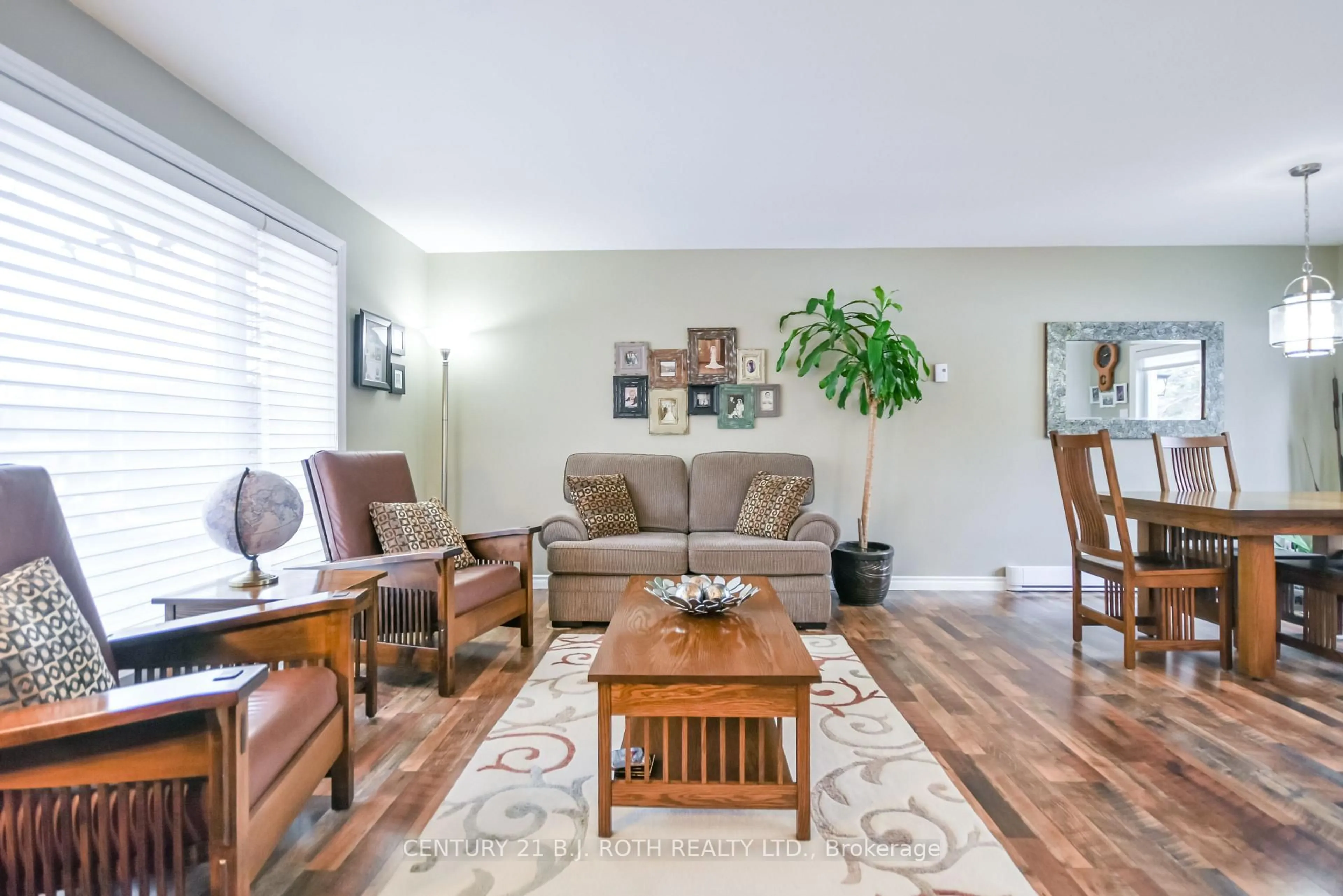 Living room with furniture, wood/laminate floor for 228 Spencer Ave, Essa Ontario L0L 2N0